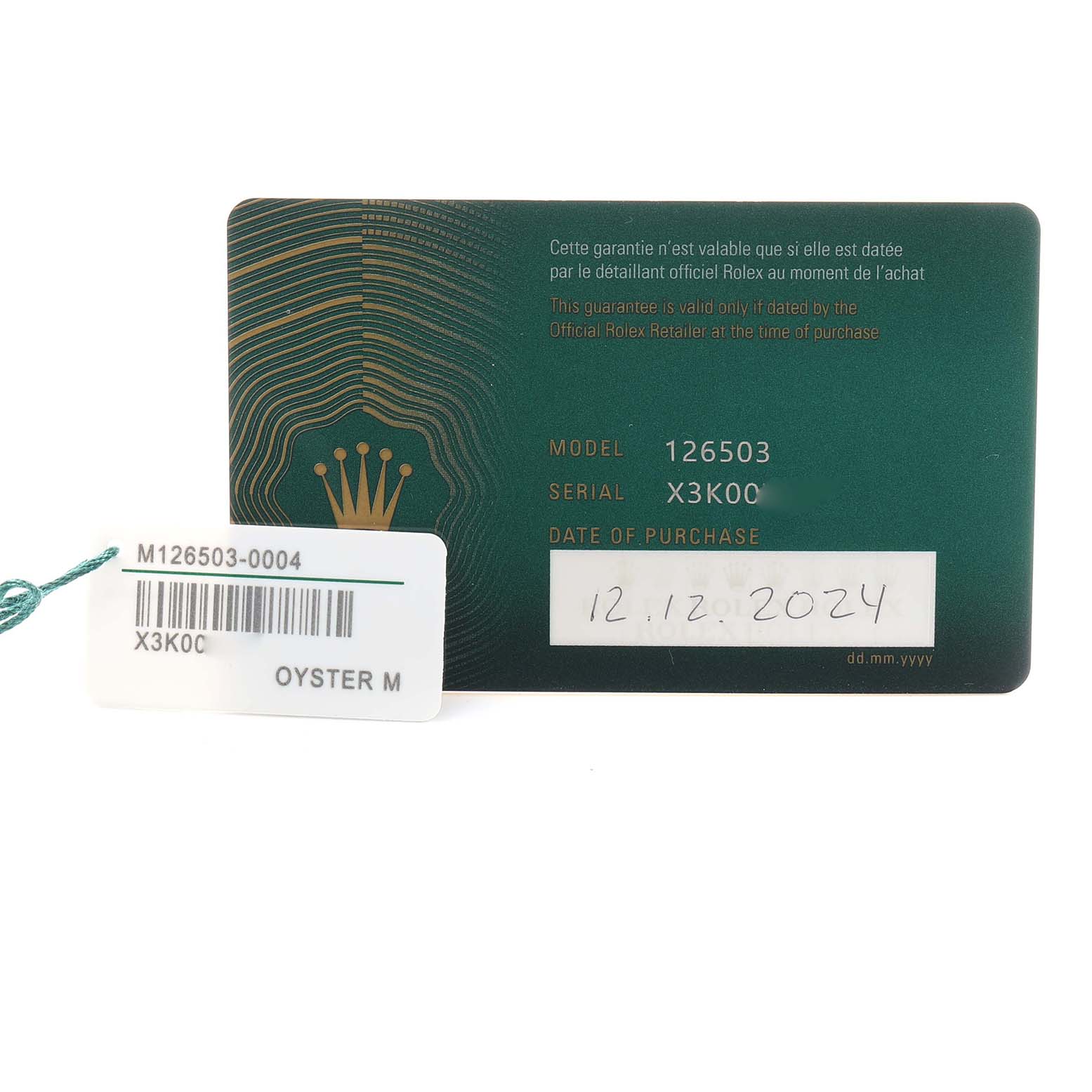 The image shows a Rolex Daytona 126503 Men
s Steel and Gold (two tone) Champagne Dial model warranty card and a tag with model details.