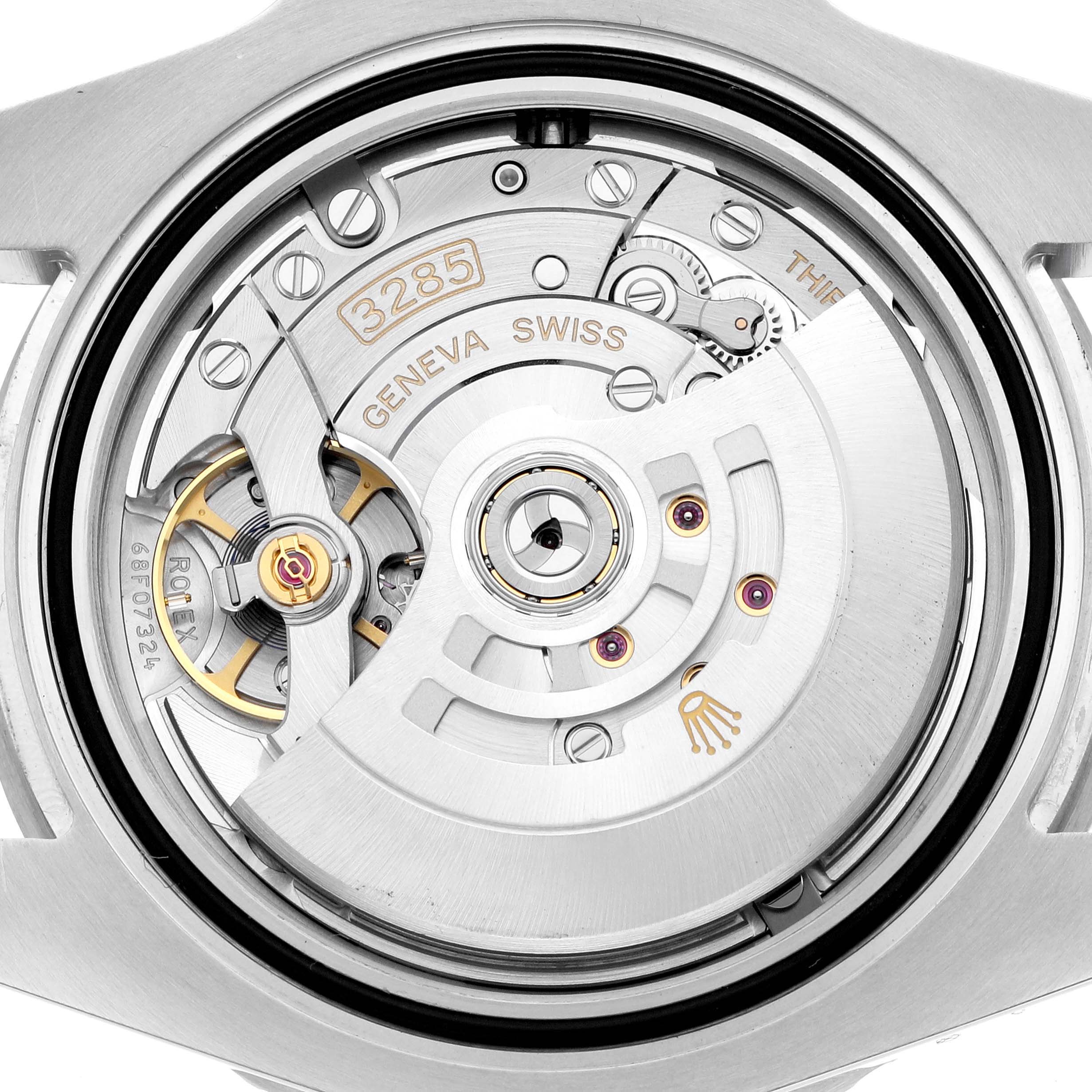 The image shows the movement of a Rolex GMT-Master 126710BLNR Men
s Stainless Steel Black Dial, focusing on the rotor and intricate internal mechanics from the back.