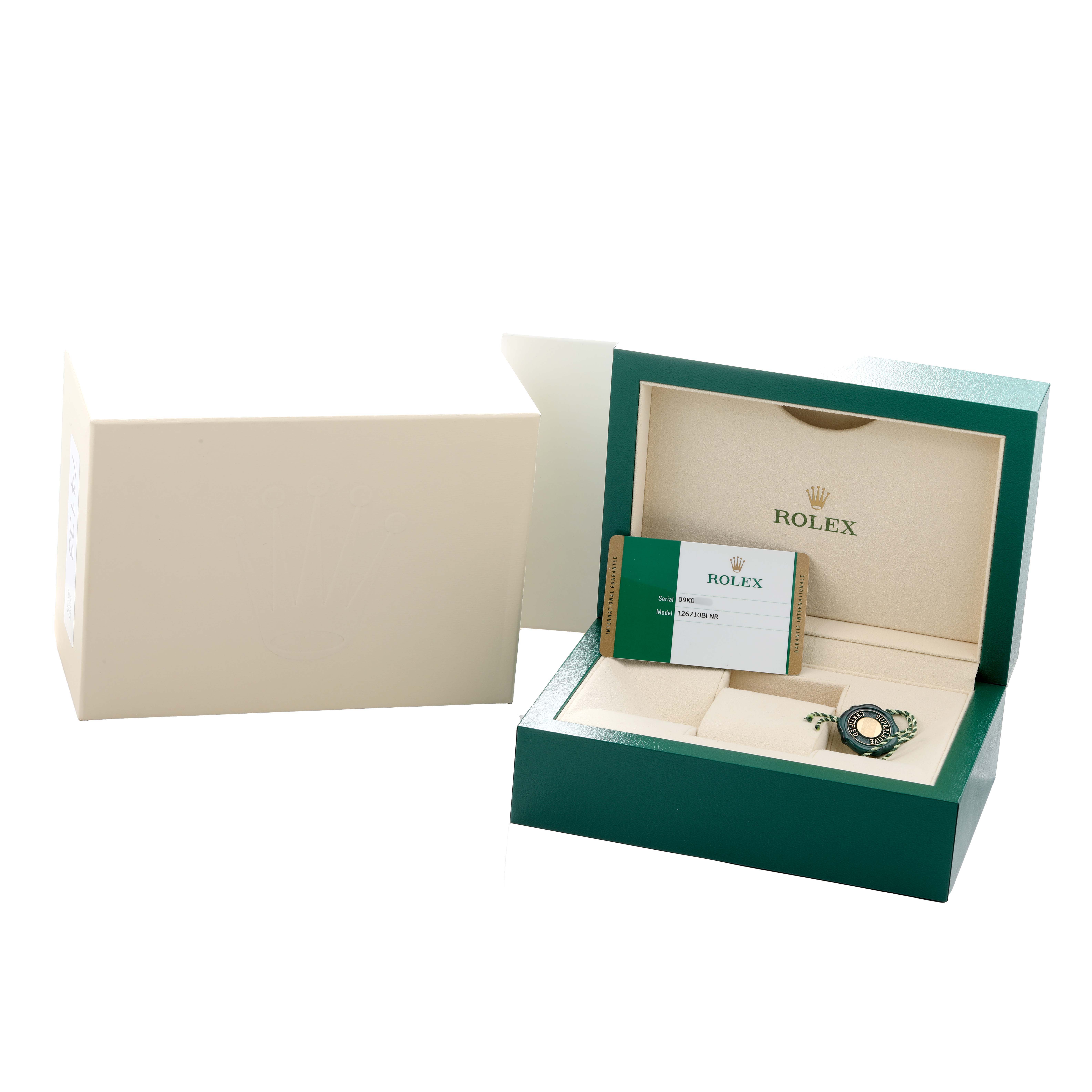 The image shows the Rolex GMT-Master 126710BLNR Men
s Stainless Steel Black Dial watch packaging, including an open box, card, and tag, viewed from the top angle.