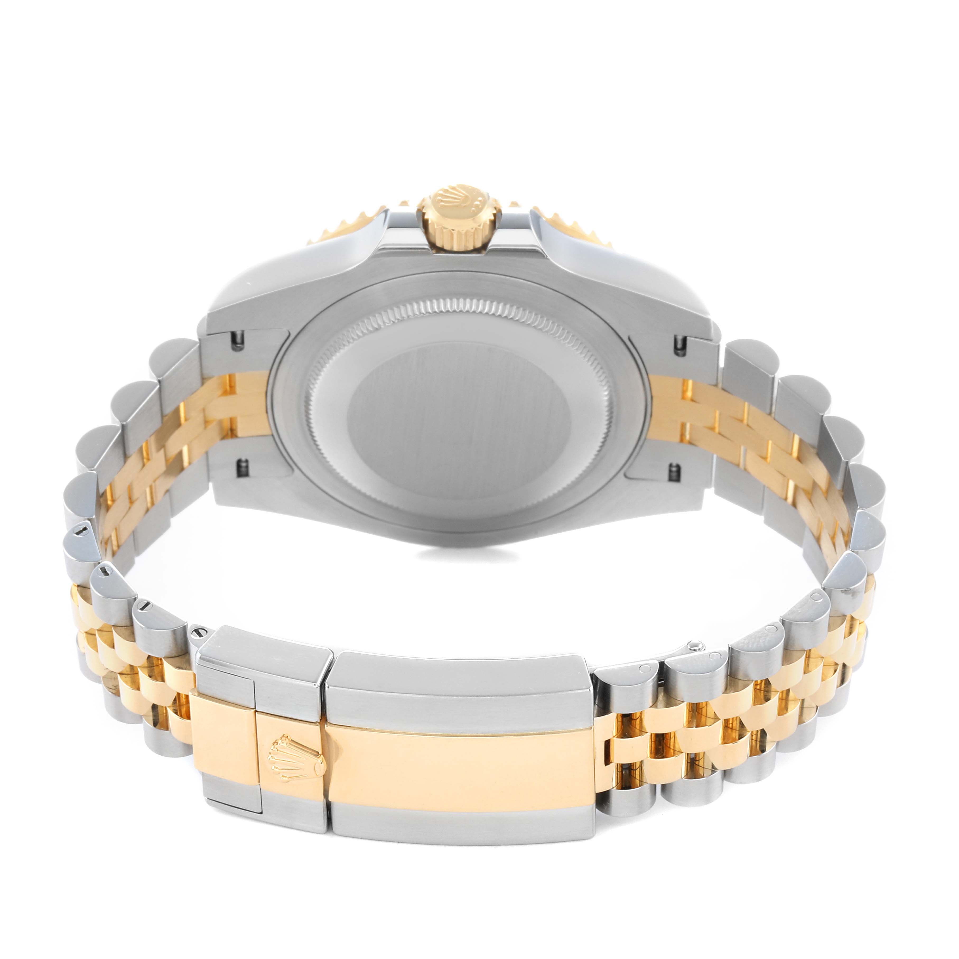The image shows the back case and bracelet clasp of a Rolex GMT-Master 126713 Men
s Steel and Gold (two tone) Black Dial, featuring a two-tone metal design.