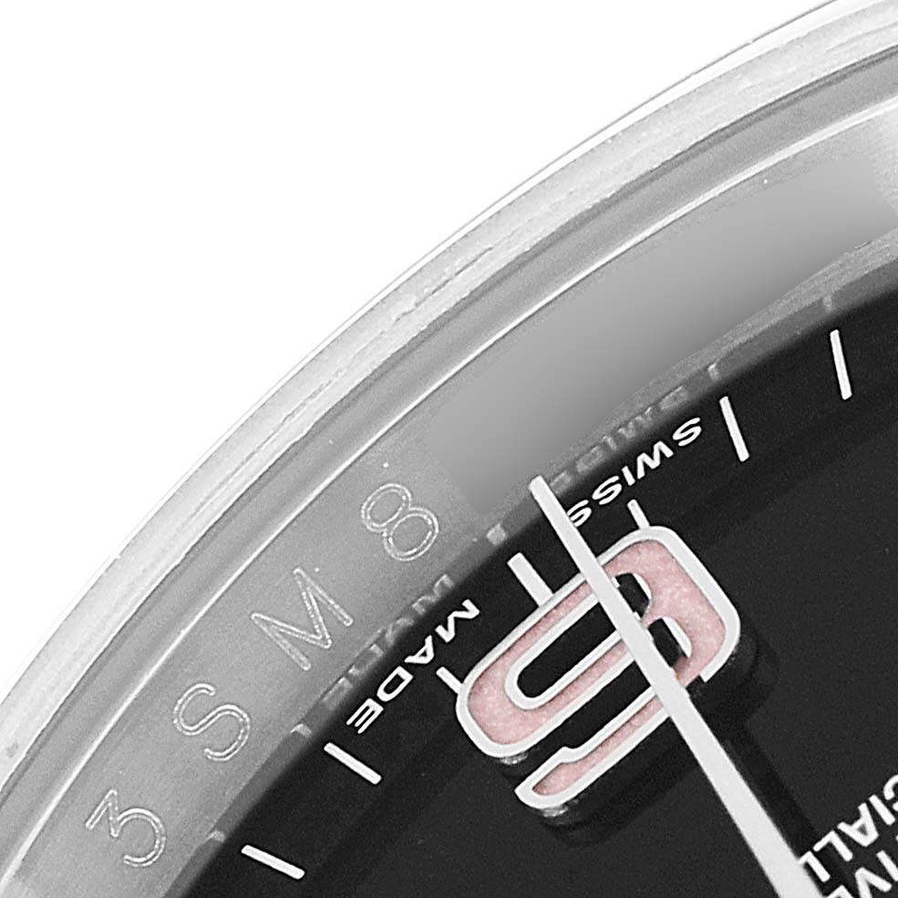 This image shows a close-up of the dial of a Rolex Oyster Perpetual 116000 Men
s Stainless Steel Black Dial 116000 Men
s Stainless Steel Black Dial watch, highlighting the number 9, the minute markers, and part of the "Swiss Made" text.