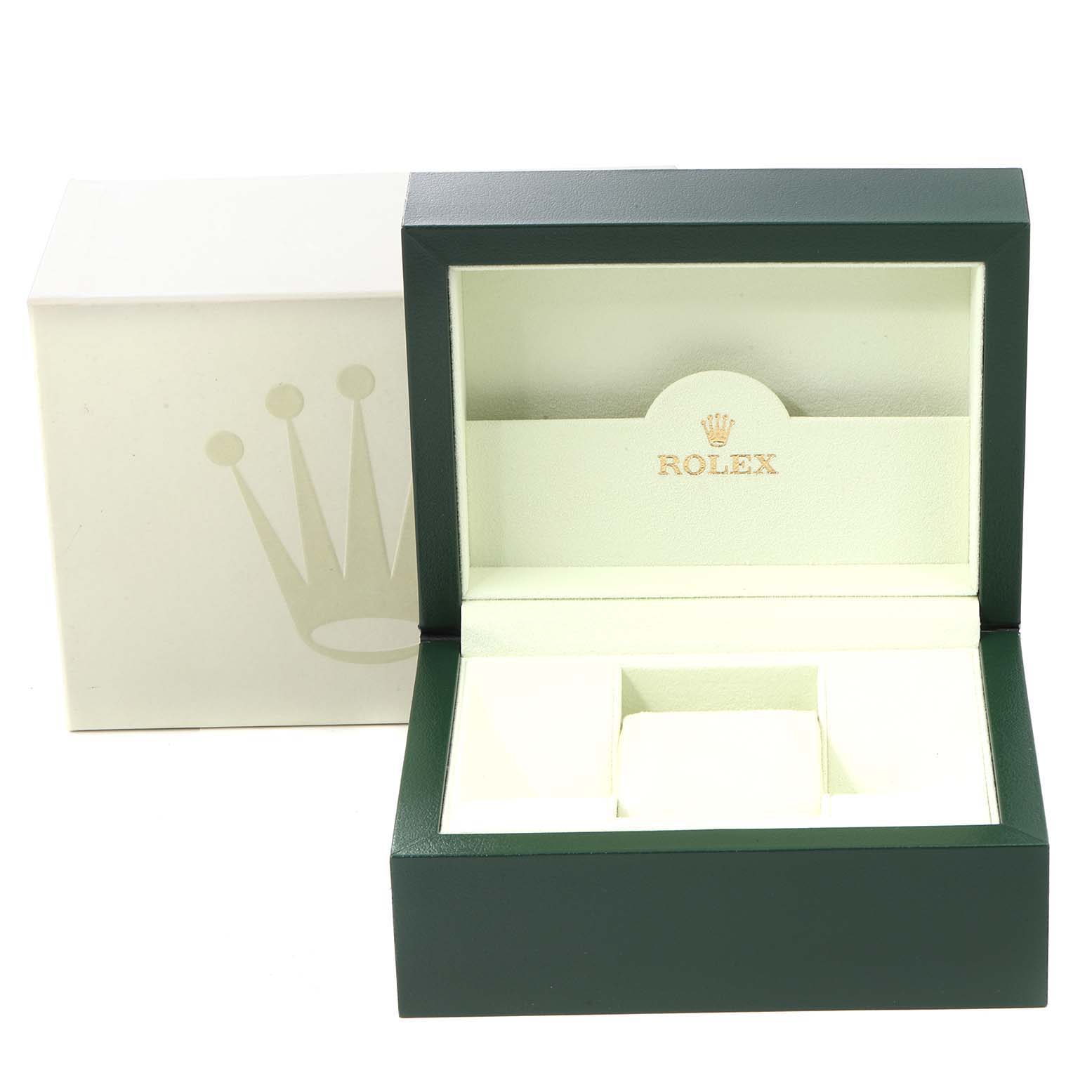 The image shows an open green and cream watch box for the Rolex Oyster Perpetual 116000 Men
s Stainless Steel Black Dial 116000 Men
s Stainless Steel Black Dial model, with the Rolex logo inside.