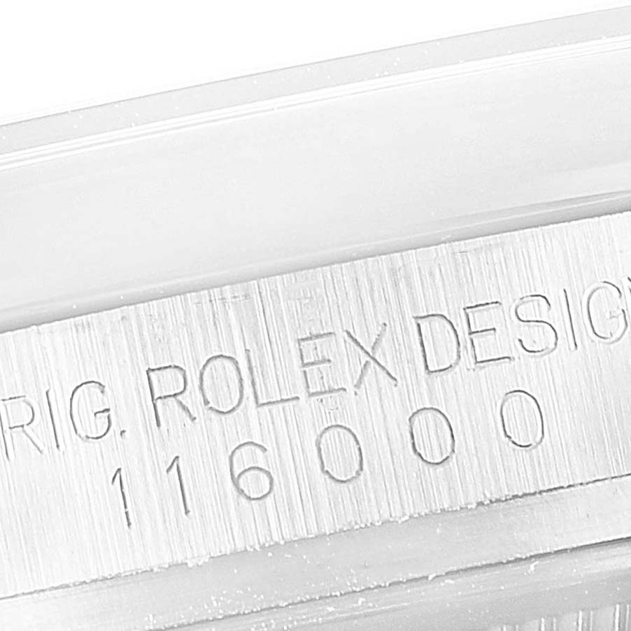 This image shows a close-up of the side engraving on the case of a Rolex Oyster Perpetual 116000 Men
s Stainless Steel Black Dial 116000 Men
s Stainless Steel Black Dial watch.