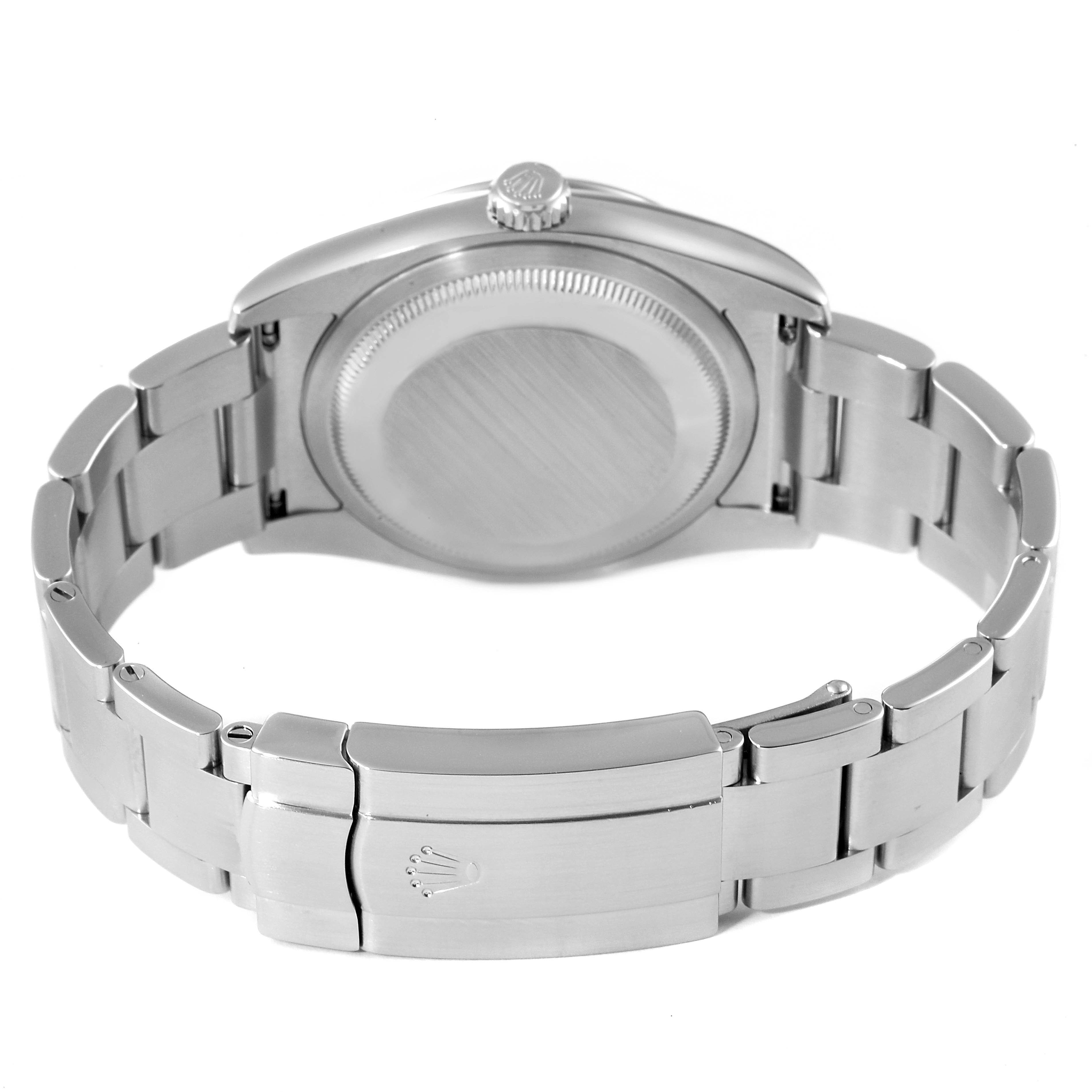 The image shows the back view of a Rolex Oyster Perpetual 116000 Men
s Stainless Steel Black Dial 116000 Men
s Stainless Steel Black Dial watch, highlighting its bracelet and clasp.