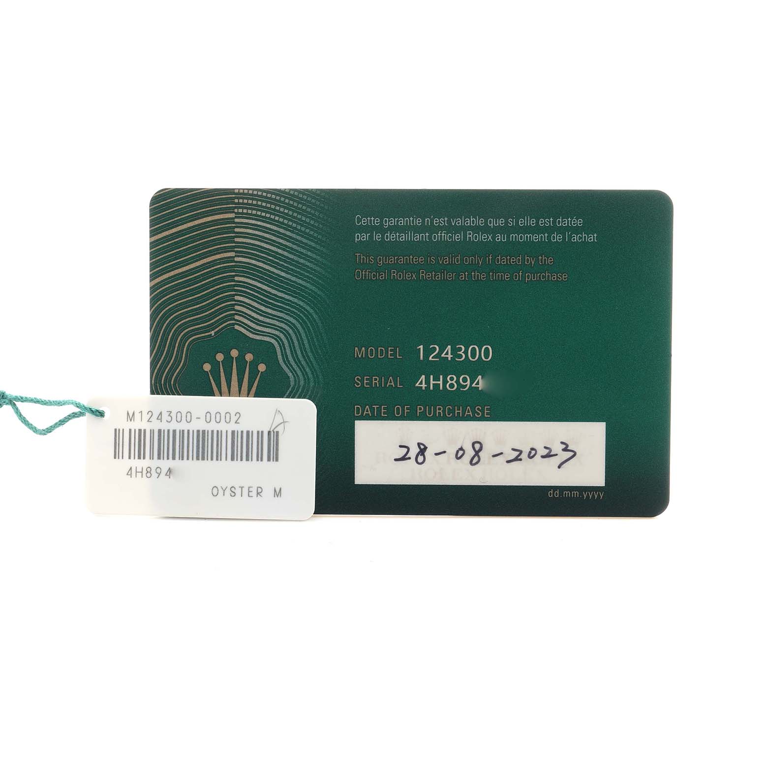 The image shows a warranty card and tag for the Rolex Oyster Perpetual 124300 Men
s Stainless Steel Black Dial model 124300, displaying the serial number and purchase date.