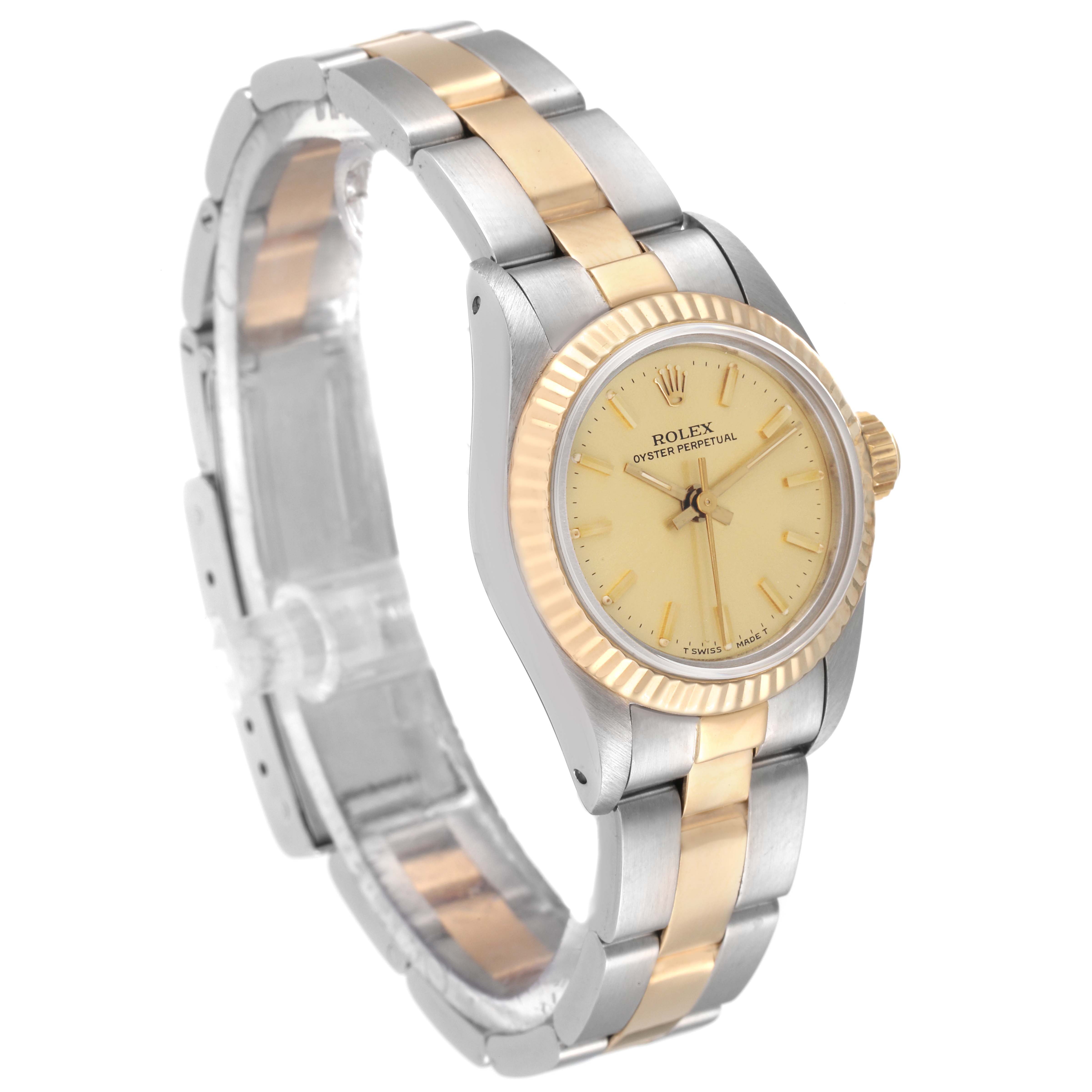 This Rolex Oyster Perpetual 67193 Women
s Steel and Gold (two tone) Champagne Dial 67193 Women
s Steel and Gold (two tone) Champagne Dial watch is shown at a three-quarter angle, highlighting the face, bezel, and bracelet.