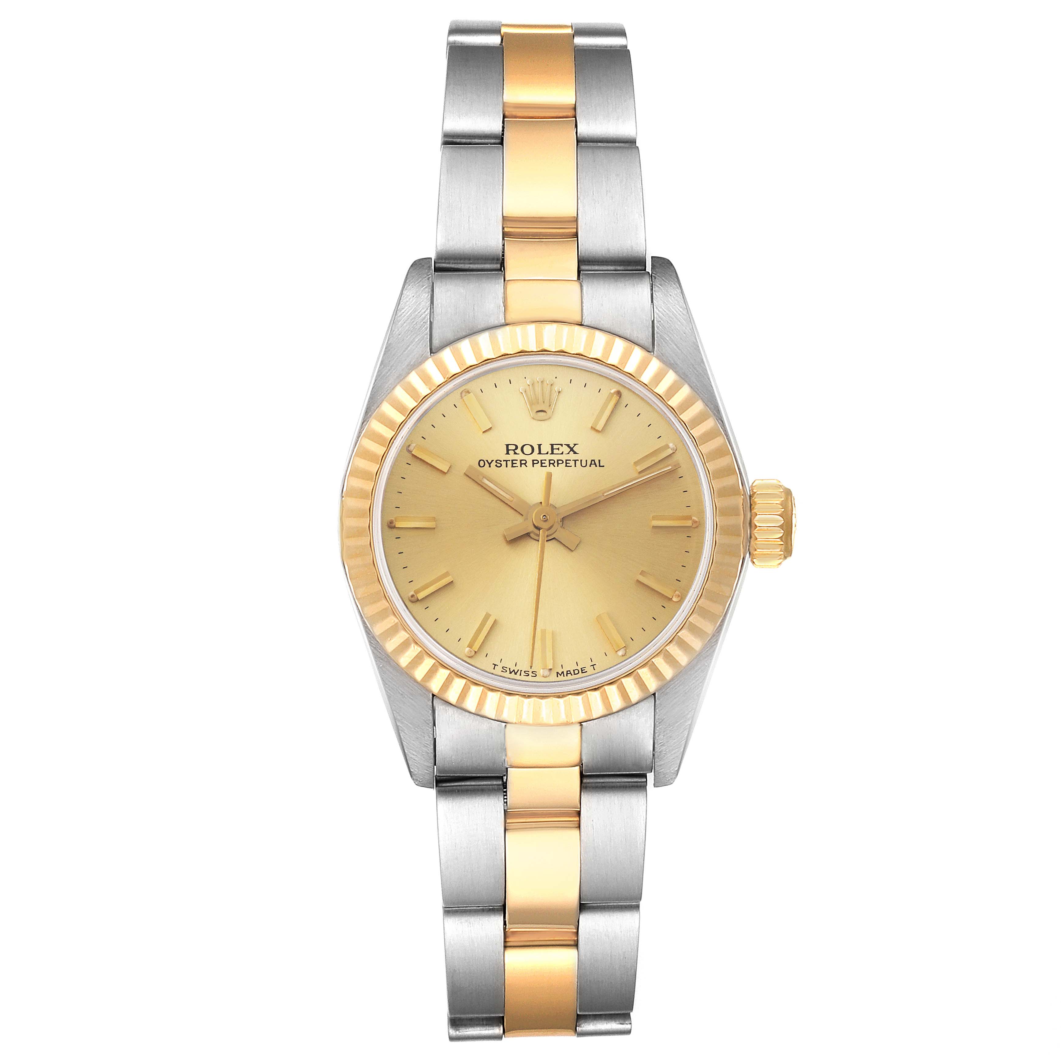 This image shows a front view of the Rolex Oyster Perpetual 67193 Women
s Steel and Gold (two tone) Champagne Dial 67193 Women
s Steel and Gold (two tone) Champagne Dial watch, highlighting its gold dial, fluted bezel, and two-tone bracelet.