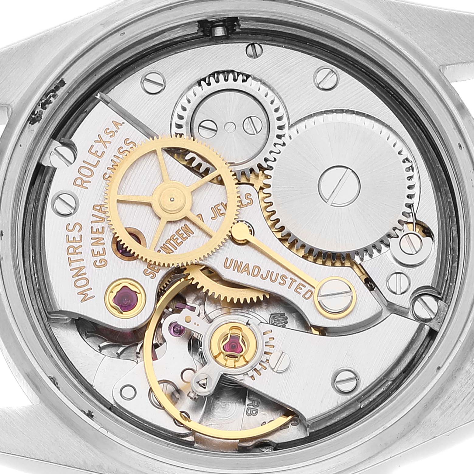 The image shows the internal mechanical movement components of a Mid-Size Rolex watch at a close-up angle.