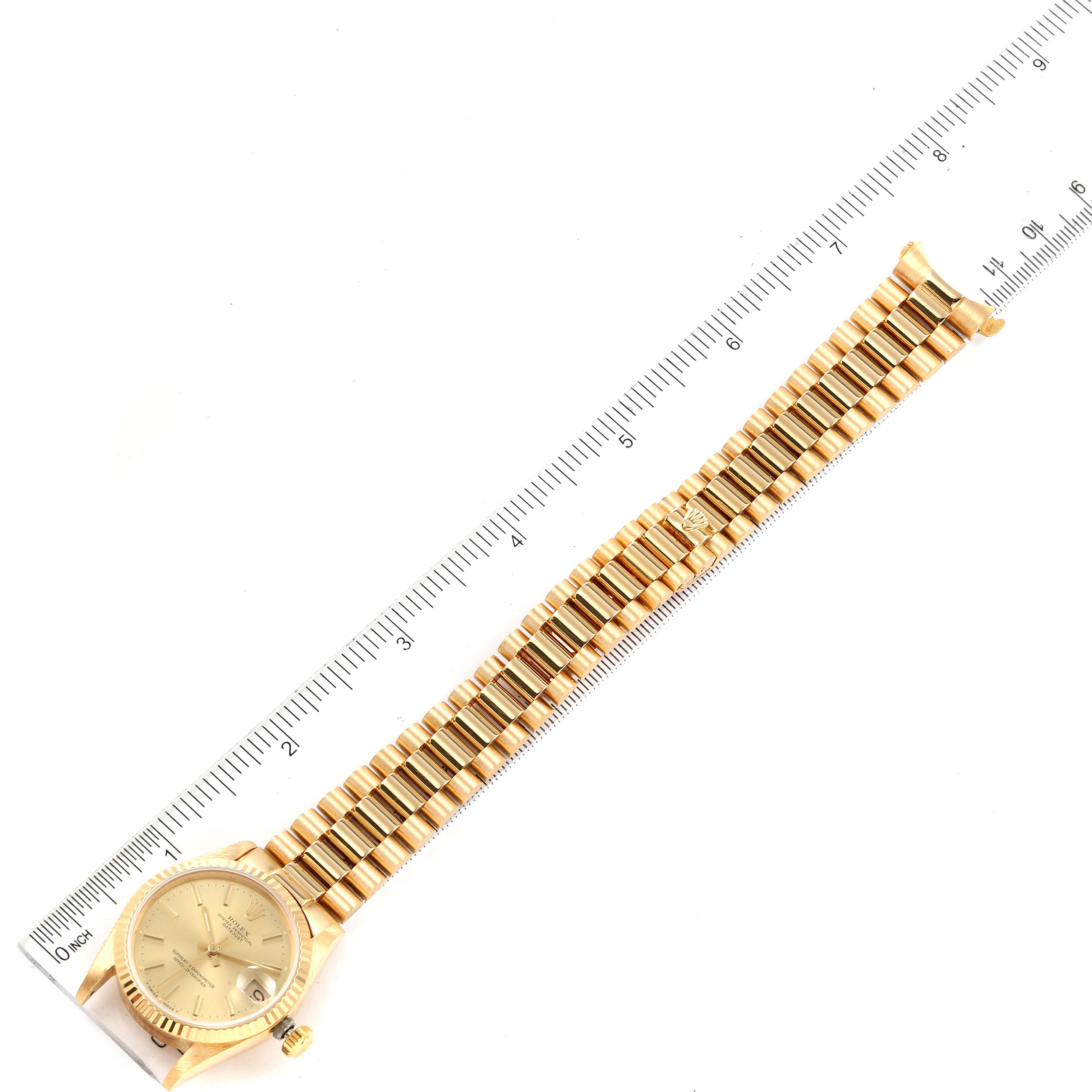 The image shows a top-down view of a Rolex President 68278 Women's Yellow Gold Champagne Dial 68278 Women's Yellow Gold Champagne Dial model watch, displaying the dial and entire bracelet.