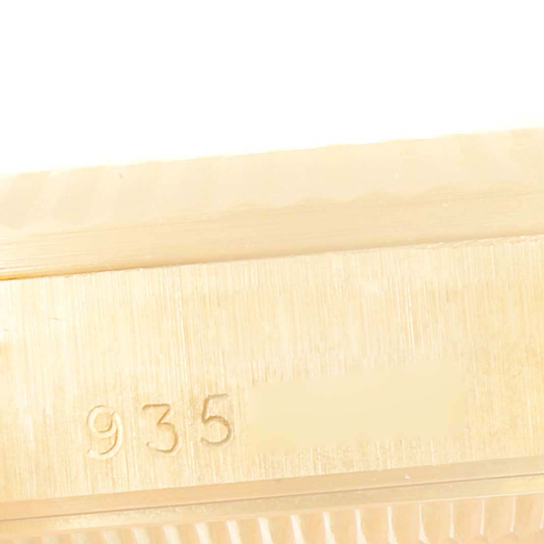 This image shows a close-up angle of the bezel and case side with serial number on a Rolex President 68278 Women's Yellow Gold Champagne Dial 68278 Women's Yellow Gold Champagne Dial model watch.