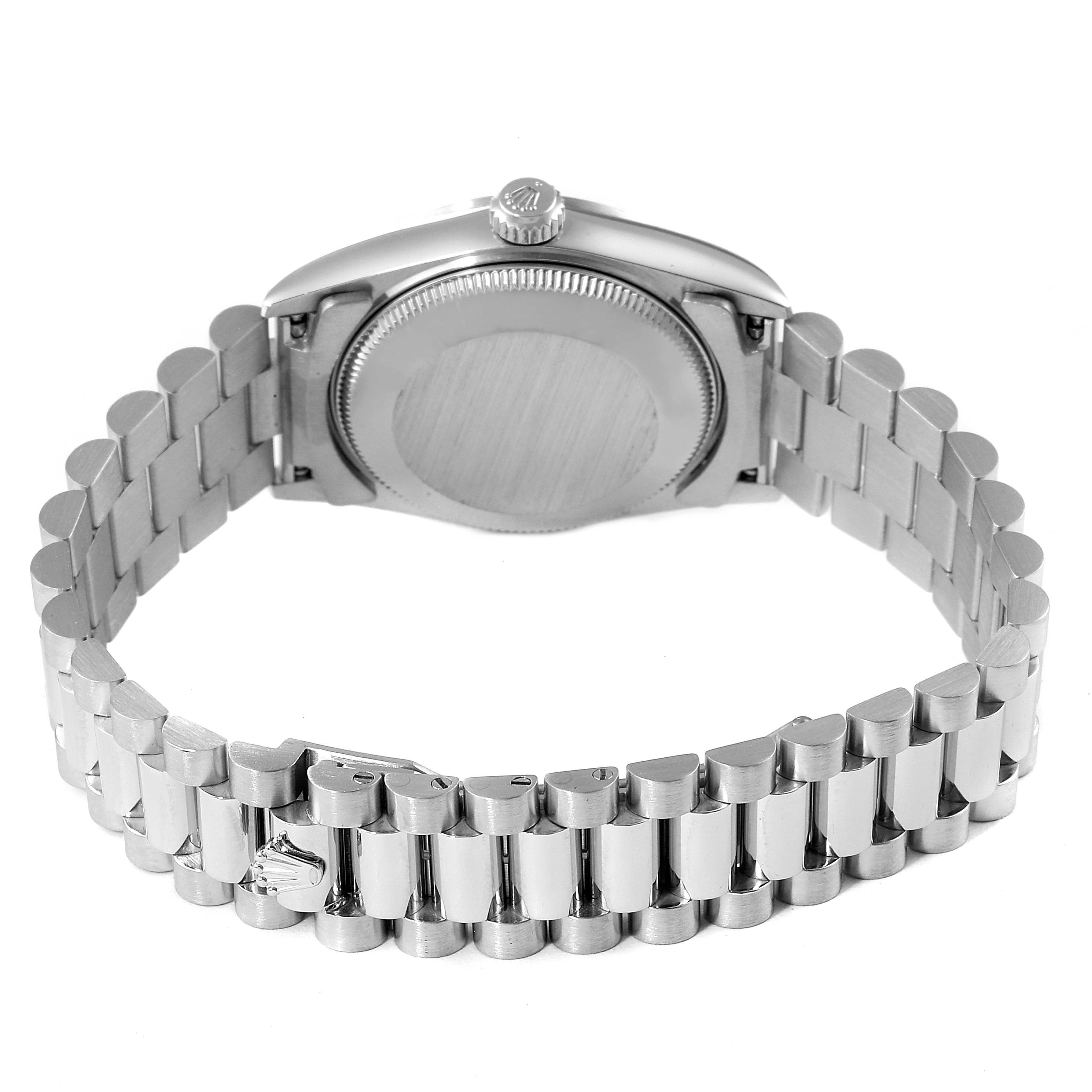 The image shows the backside of a Rolex President 68246 Women's Platinum Black Dial 68246 Women's Platinum Black Dial model watch, highlighting the case back and bracelet.