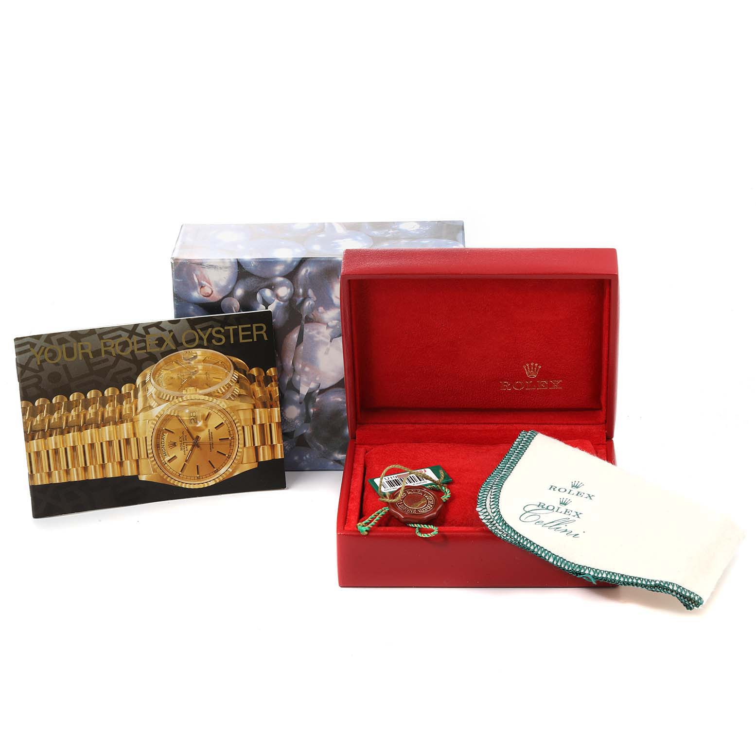 The image shows a Rolex President 68246 Women's Platinum Black Dial 68246 Women's Platinum Black Dial model watch with its box, booklet, and cleaning cloth.