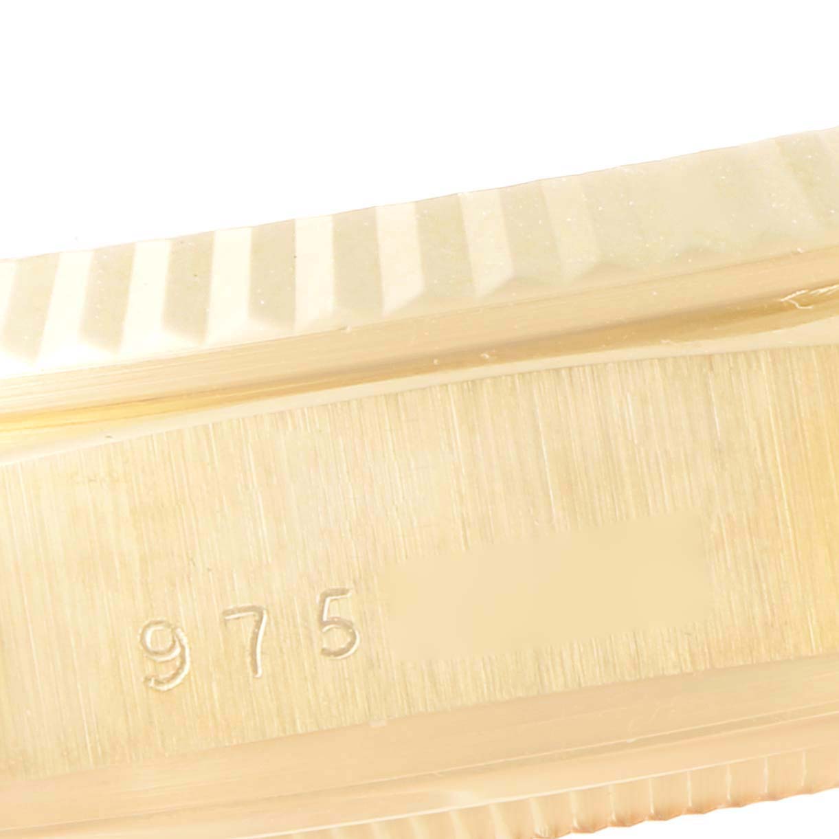 This image shows a close-up of the side bezel and serial number engraving on a Rolex President 18038 Men
s Yellow Gold Champagne Dial 18038 Men
s Yellow Gold Champagne Dial model watch.