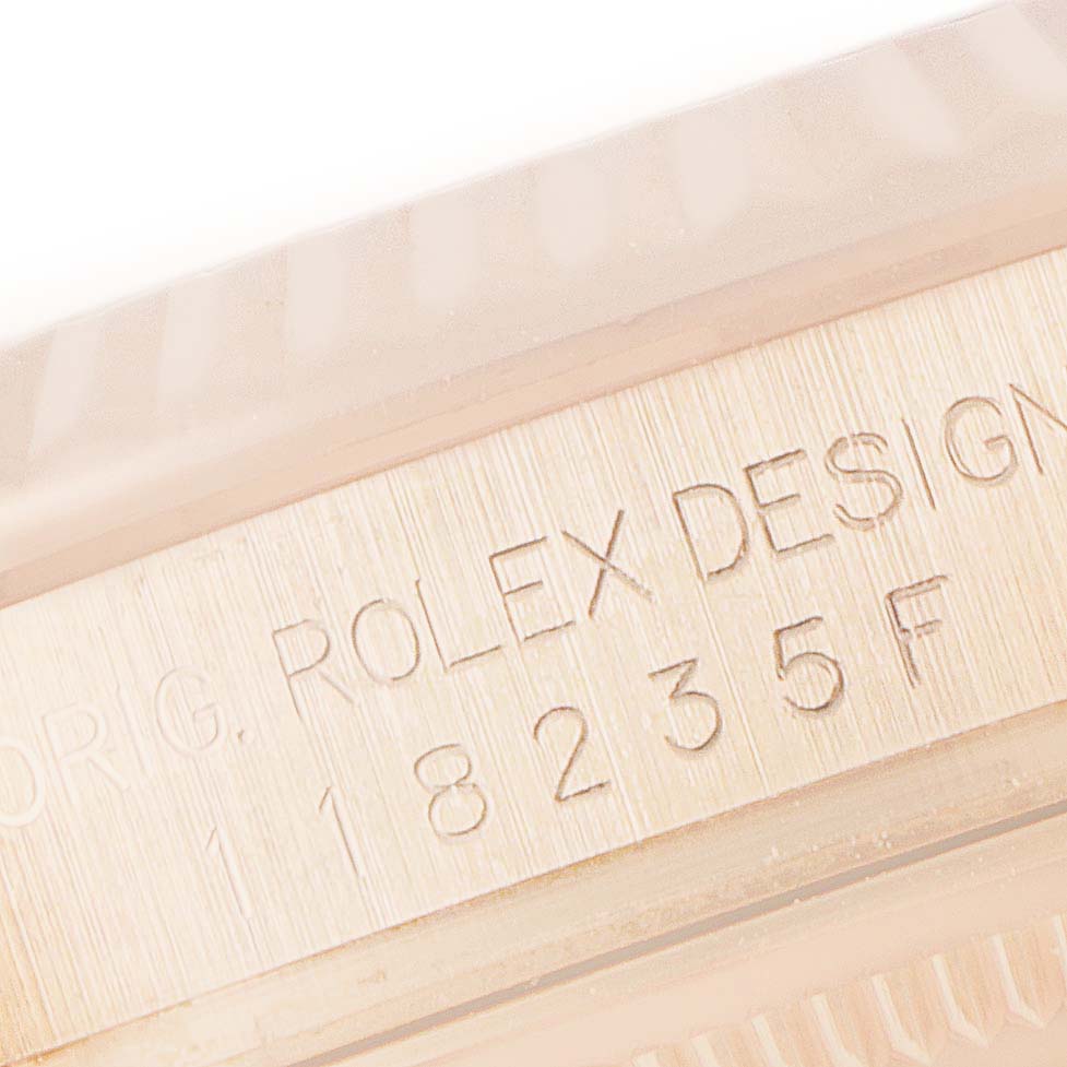 This image shows a close-up of the case side engraving on a Rolex President 118235 Men's Rose Gold Pink Dial 118235 Men's Rose Gold Pink Dial model watch.