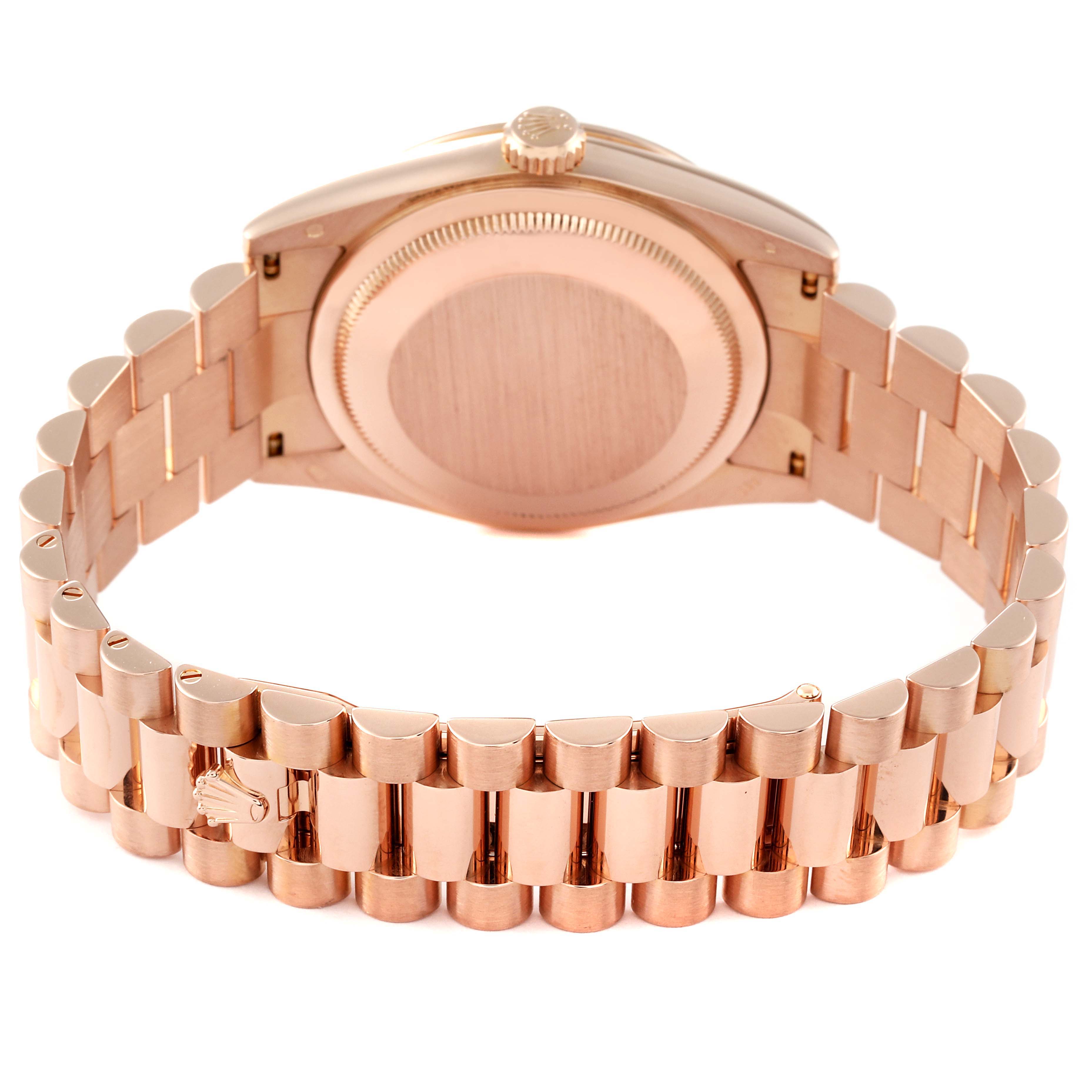 This image shows a rear view of a Rolex President 118235 Men's Rose Gold Pink Dial 118235 Men's Rose Gold Pink Dial model watch, focusing on the case back and the President bracelet.