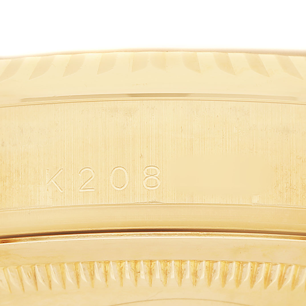 The image shows a close-up of the side of a Rolex President 118238 Men's Yellow Gold Black Dial model, displaying the bezel and part of the case with markings.
