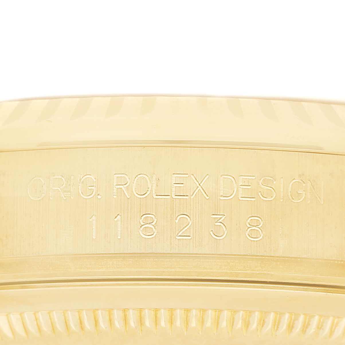 The image shows an engraved side of the Rolex President 118238 Men's Yellow Gold Black Dial model, displaying the design number.