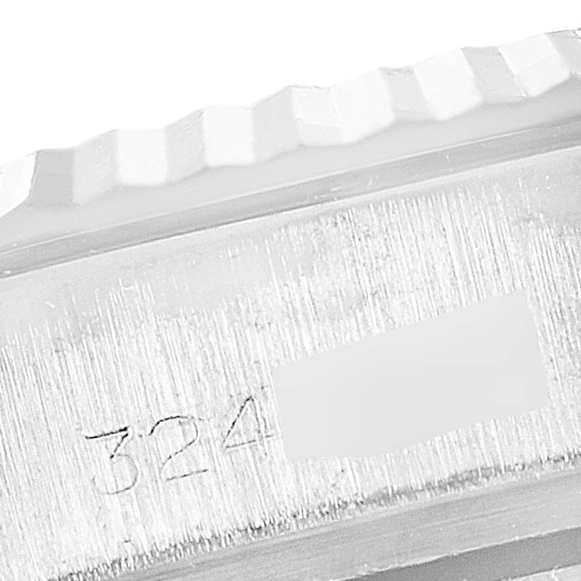 The image shows a close-up of the Rolex President 1803 Men's White Gold Black Dial 1803 Men's White Gold Black Dial model's case side with part of the serial number visible.