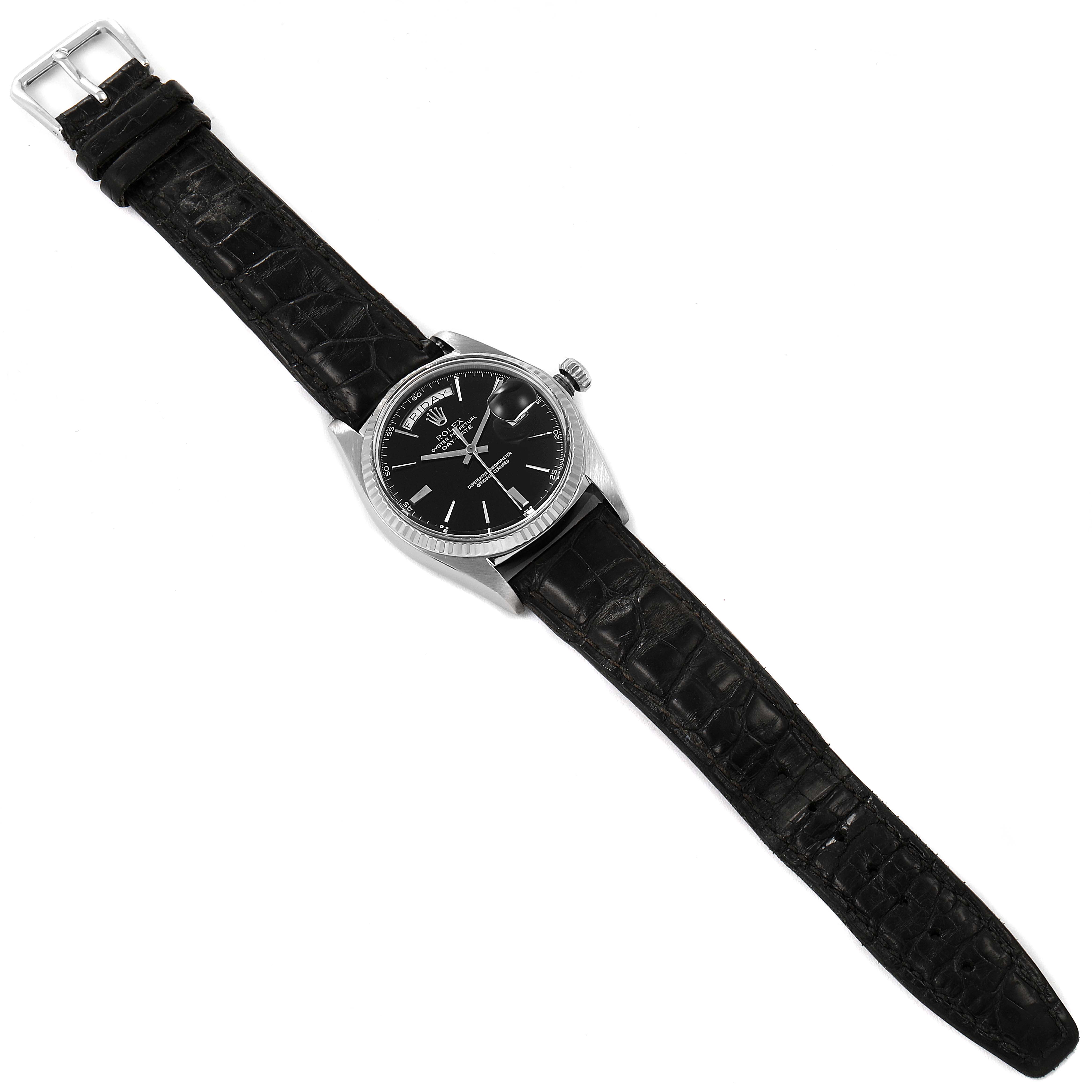 The Rolex President 1803 Men's White Gold Black Dial 1803 Men's White Gold Black Dial watch is shown from a top-down perspective, highlighting its black leather strap and black dial with silver accents.