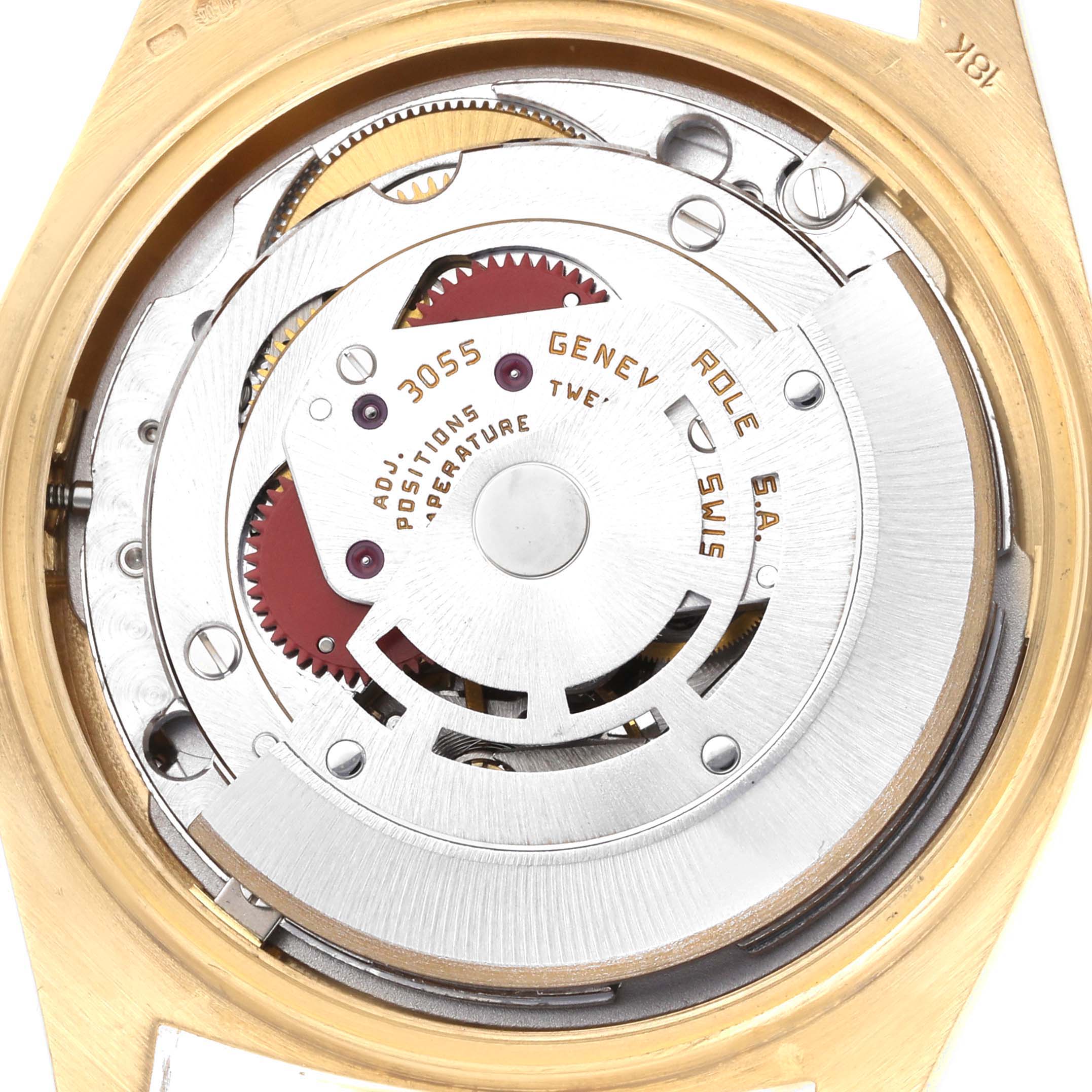 The image shows the internal movement of a Rolex President 18048 Men
s Yellow Gold Champagne Dial watch at a top-down angle, revealing gears and text details.