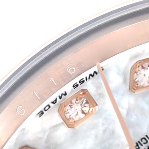 The image shows a close-up of a Rolex President 179175 Women
s Rose Gold Mother of Pearl Dial watch dial with diamond markers and the words "SWISS MADE."