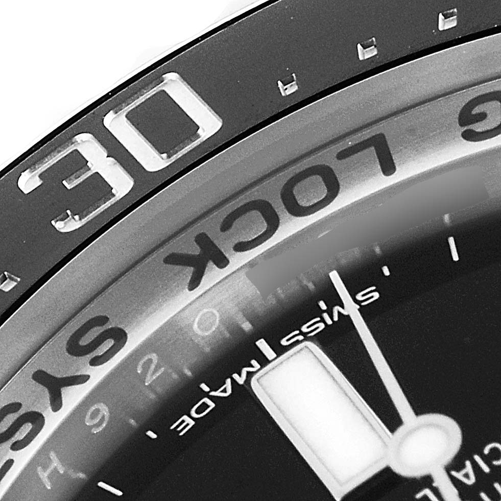 This close-up image of a Rolex Sea-Dweller 116660 Men's Stainless Steel Blue Dial 116660 Men's Stainless Steel Blue Dial watch shows the bezel, part of the dial, and the "Swiss Made" marking.