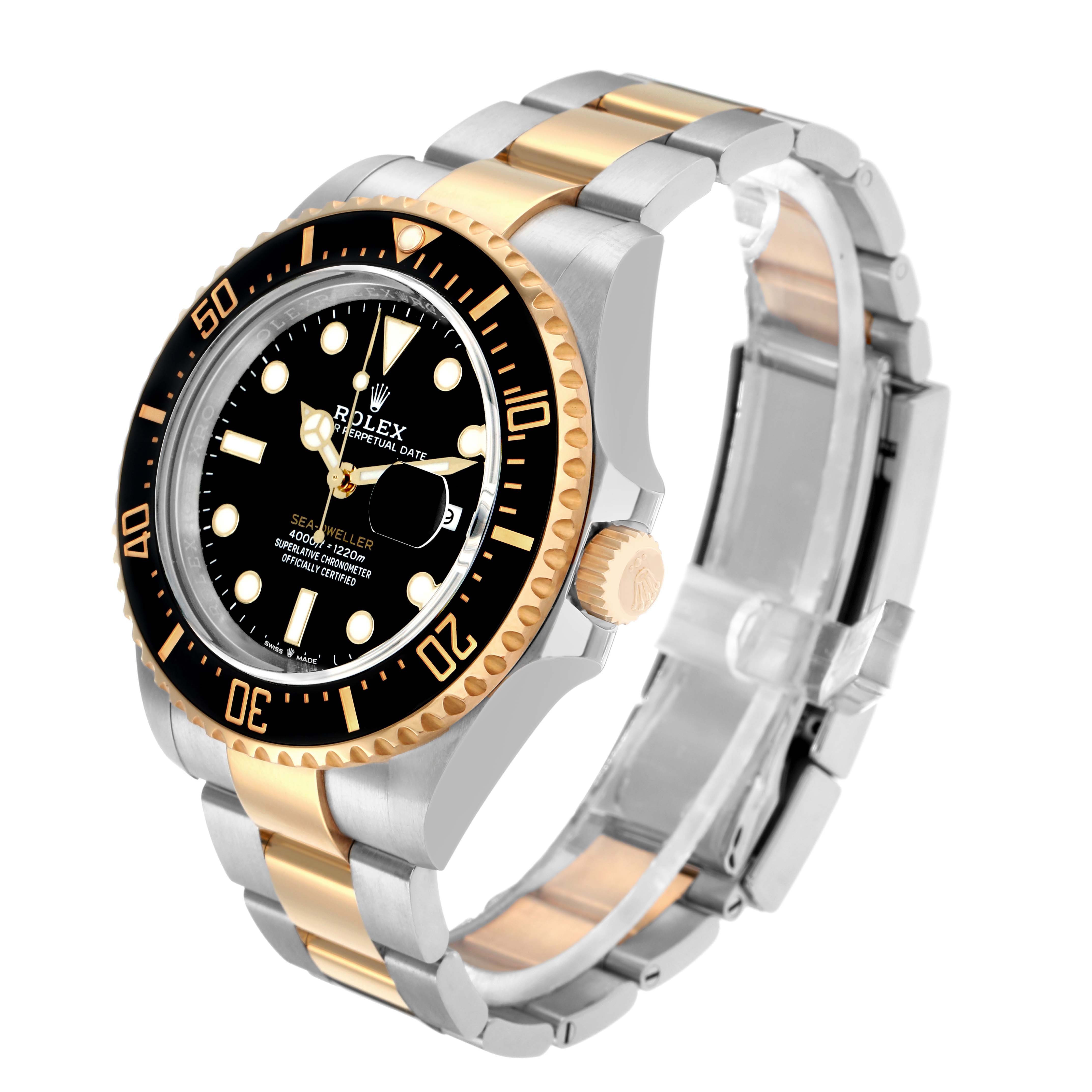 The Rolex Sea-Dweller 126603 Men
s Steel and Gold (two tone) Black Dial watch is shown at an angle highlighting the bezel, crown, and bracelet.