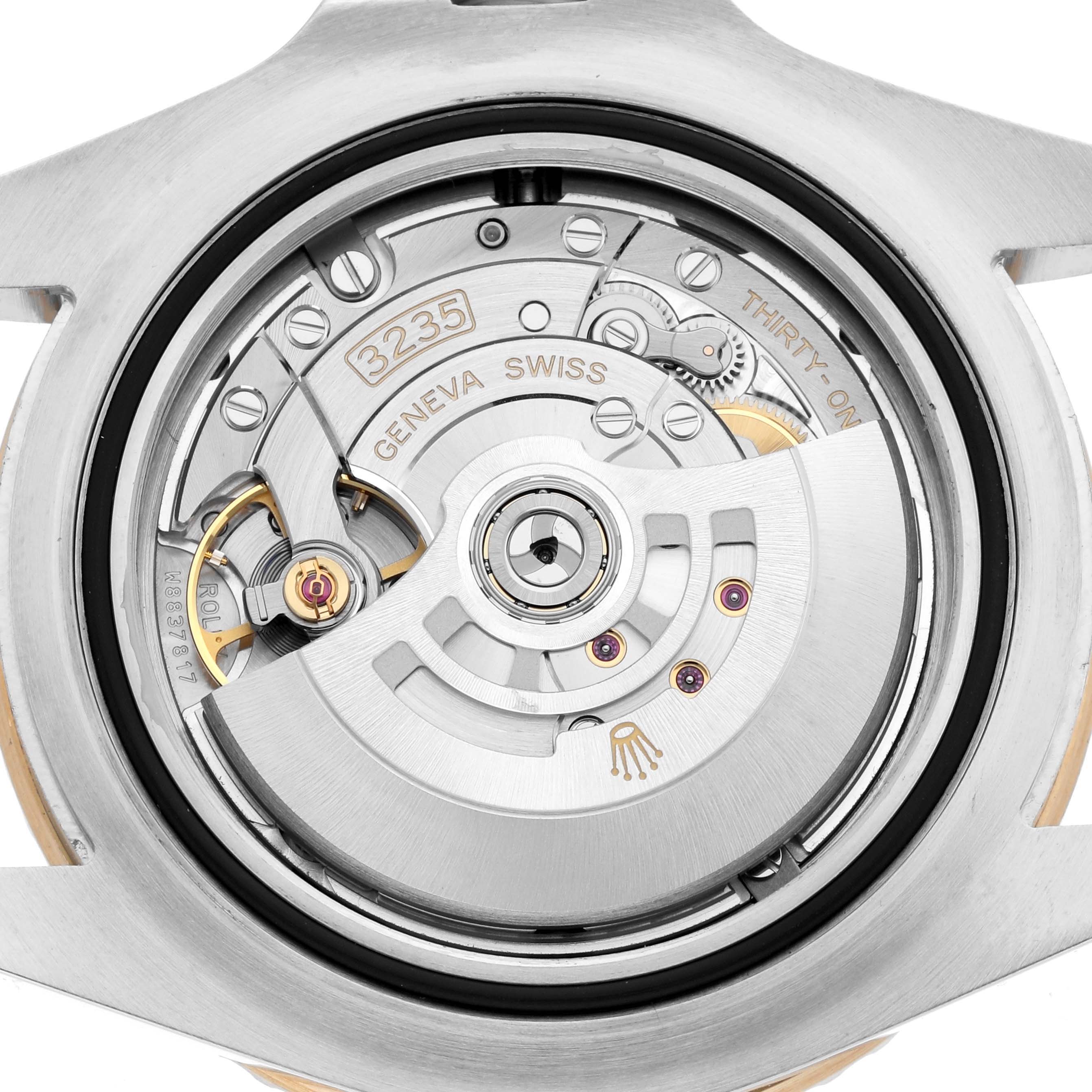 The image shows the back view of the Rolex Sea-Dweller 126603 Men
s Steel and Gold (two tone) Black Dial, highlighting its movement and rotor.