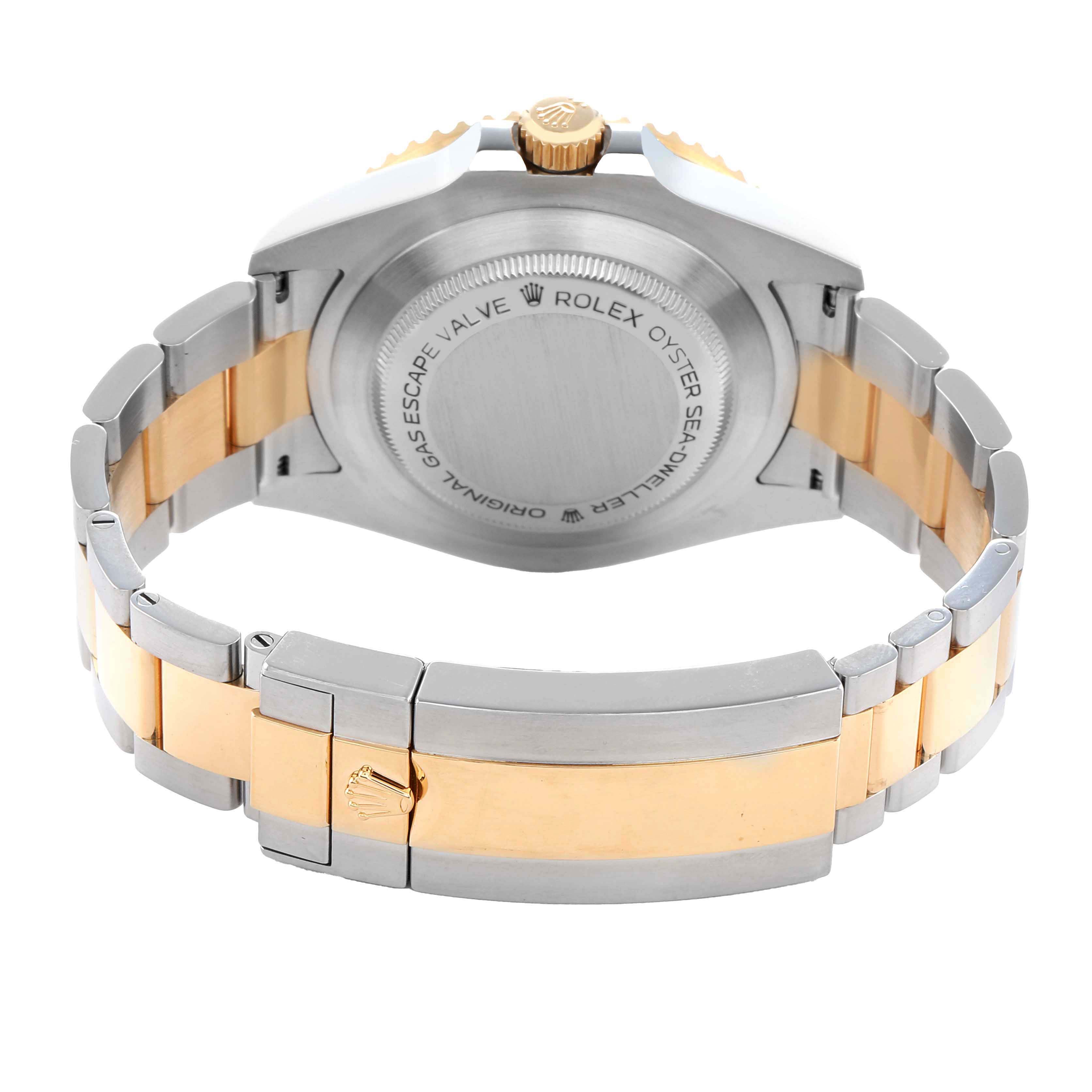 The Rolex Sea-Dweller 126603 Men
s Steel and Gold (two tone) Black Dial watch is shown from the back, highlighting the case back, crown, and two-tone bracelet.