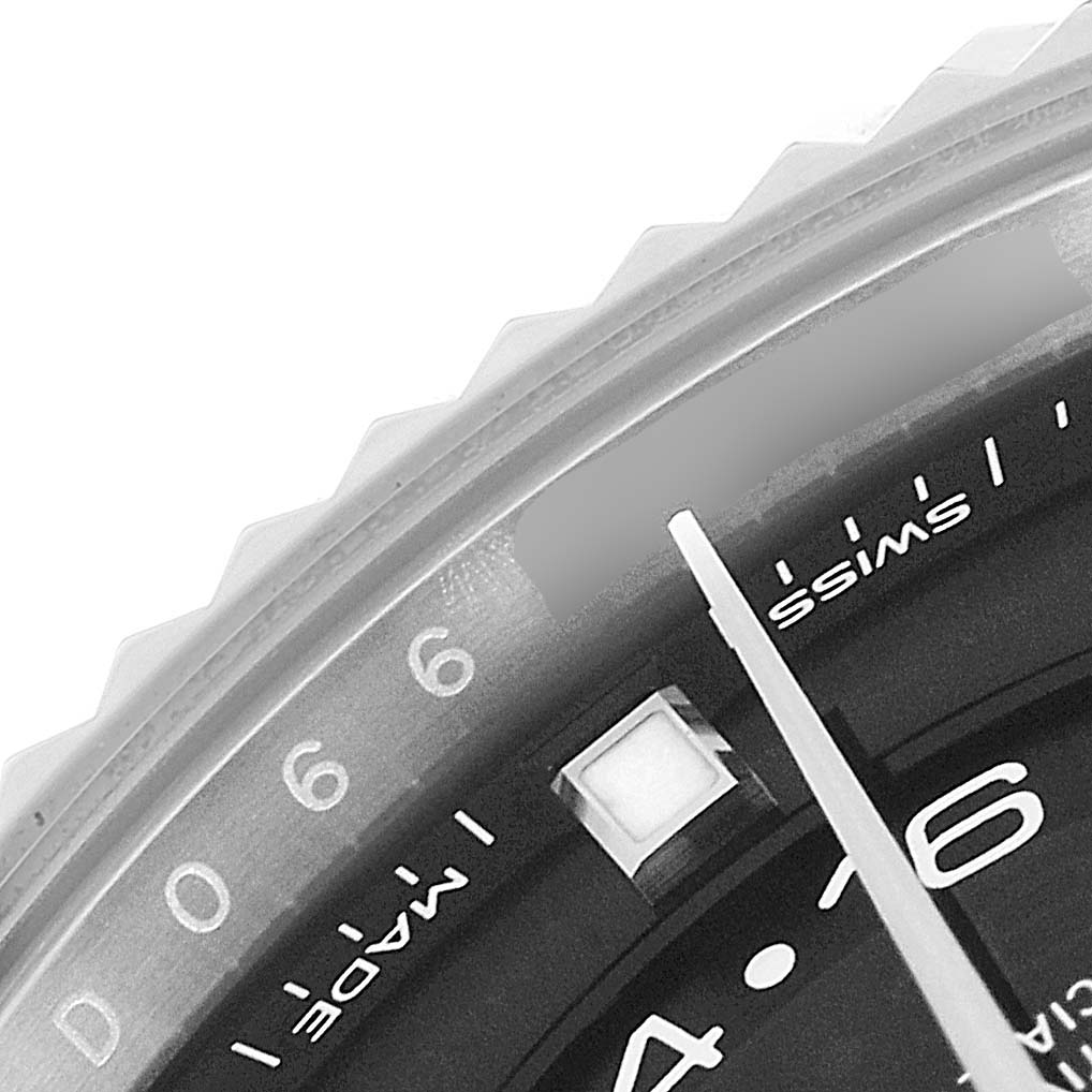 The image shows a detailed close-up of the Rolex Sky-Dweller 326934 Men's Stainless Steel Black Dial 326934 Men's Stainless Steel Black Dial watch, highlighting the bezel, part of the dial, and the minute hand.
