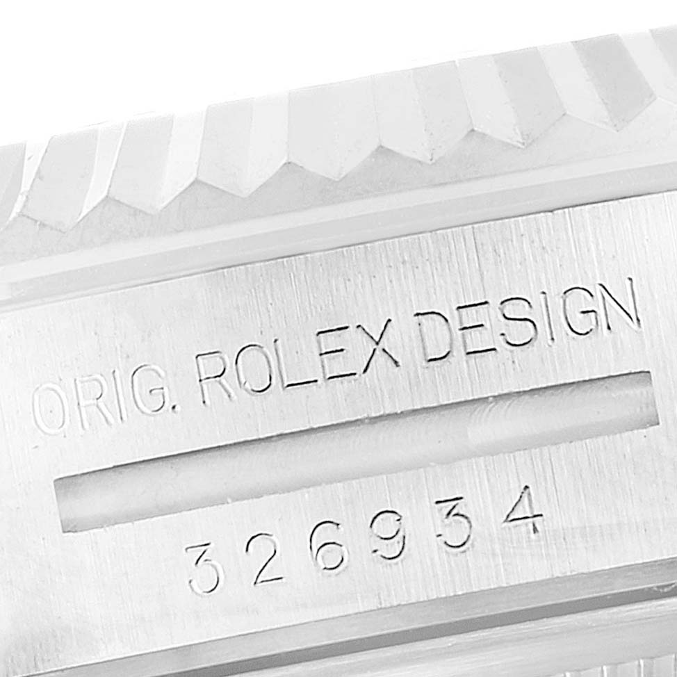 This image shows a close-up of the bezel and engraved reference number of a Rolex Sky-Dweller 326934 Men's Stainless Steel Black Dial 326934 Men's Stainless Steel Black Dial watch.