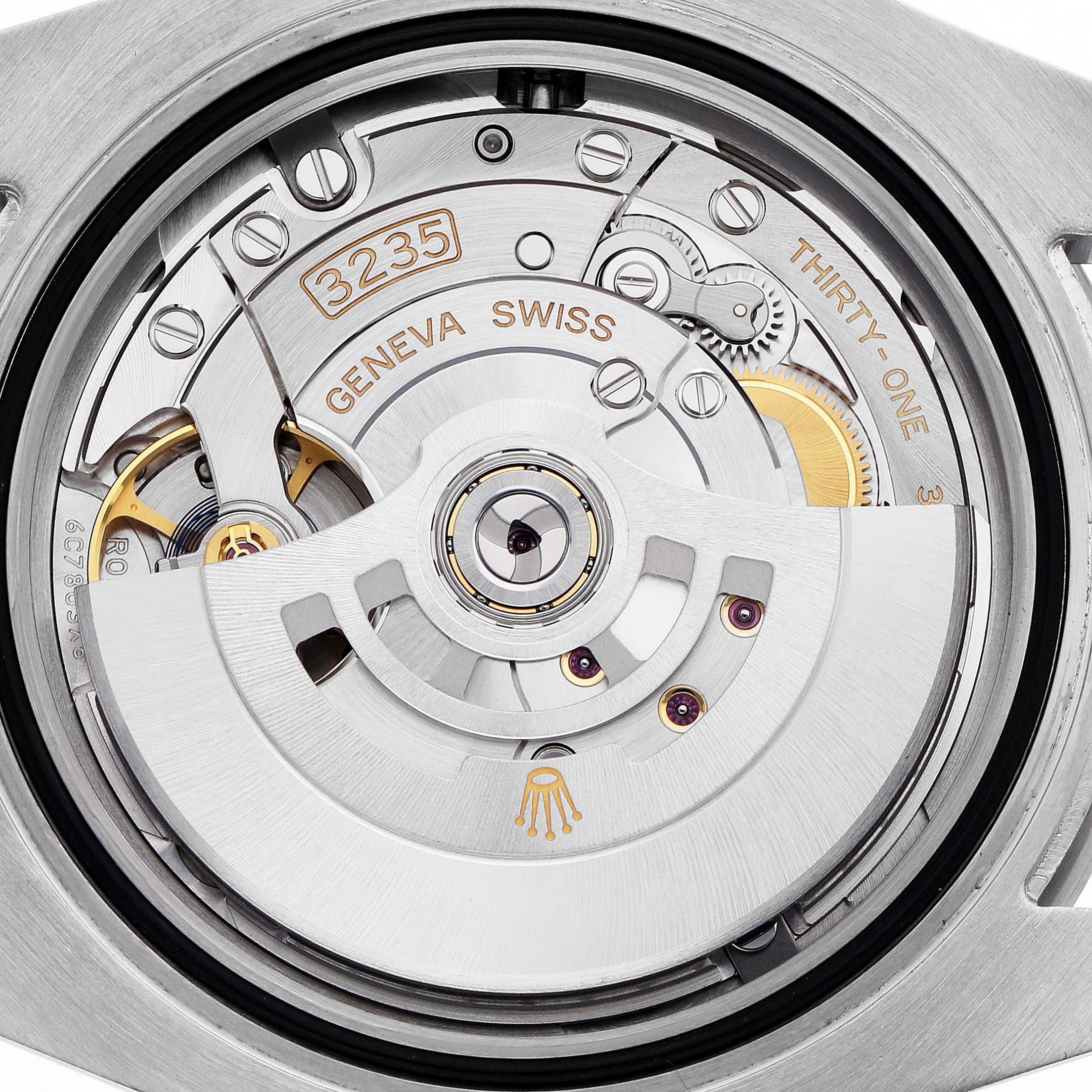 The image shows the movement mechanism of the Rolex Submariner 126610 Men
s Stainless Steel Black Dial, highlighting the rotor and gears from the back.