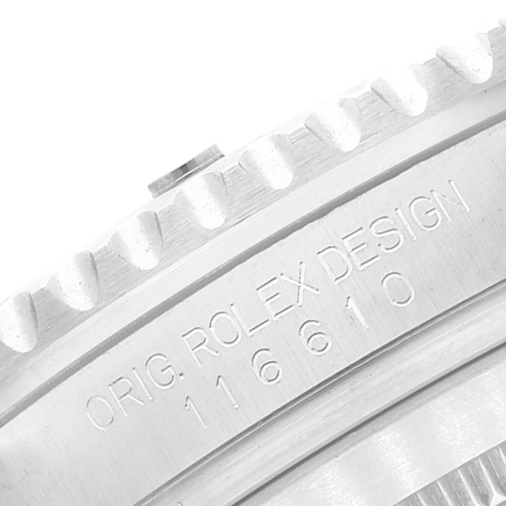 The image shows a close-up of the engraved side of the bezel and case on a Rolex Submariner 116610LV Men
s Stainless Steel Green Dial 116610LV Men
s Stainless Steel Green Dial model 116610.