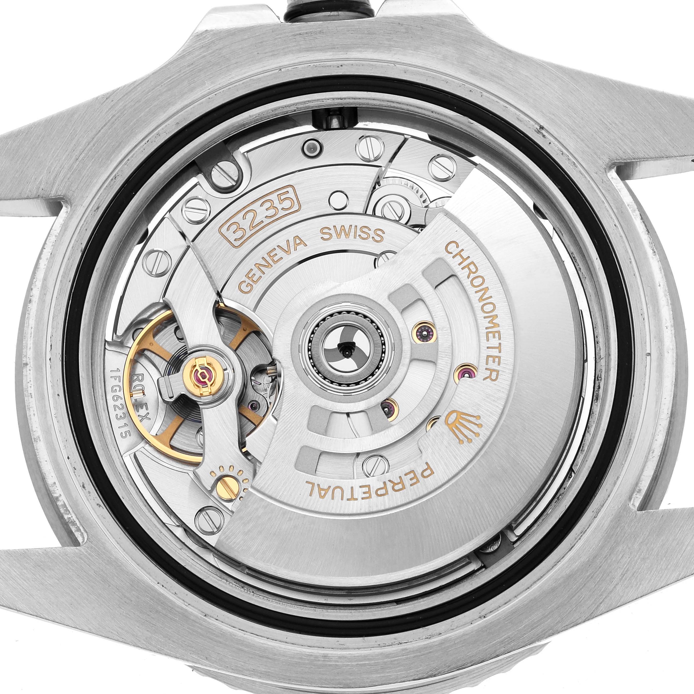 The image shows the back view of a Rolex Submariner 126610 Men
s Stainless Steel Black Dial, highlighting the movement and intricate inner components.