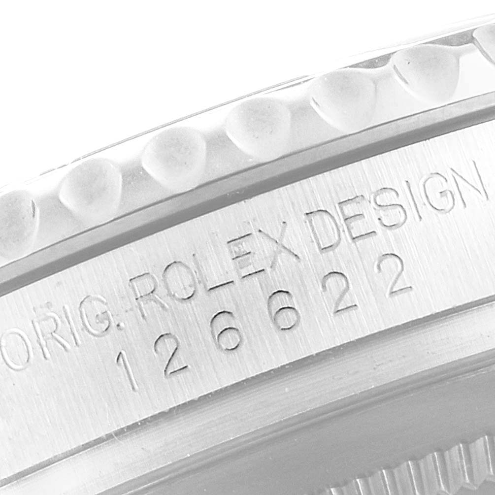 The image shows a close-up of the side of a Rolex Yacht-Master 126622 Men
s Stainless Steel Blue Dial, focusing on the engraved model number and design details.