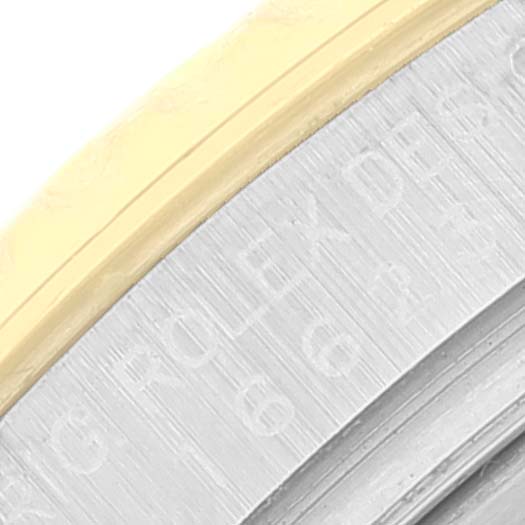 This close-up image shows a partial view of the bezel and case of a Rolex Yacht-Master 16623 Men's Steel and Gold (two tone) Grey Dial 16623 Men's Steel and Gold (two tone) Grey Dial watch.
