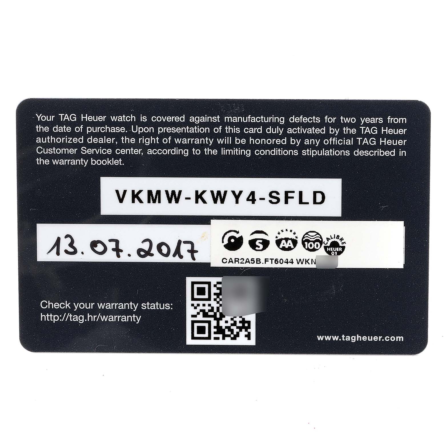 This image shows the warranty card for the Tag Heuer Carrera CAR2A5B.FT6044 Men's Titanium Black Dial CAR2A5B.FT6044 Men's Titanium Black Dial model watch.