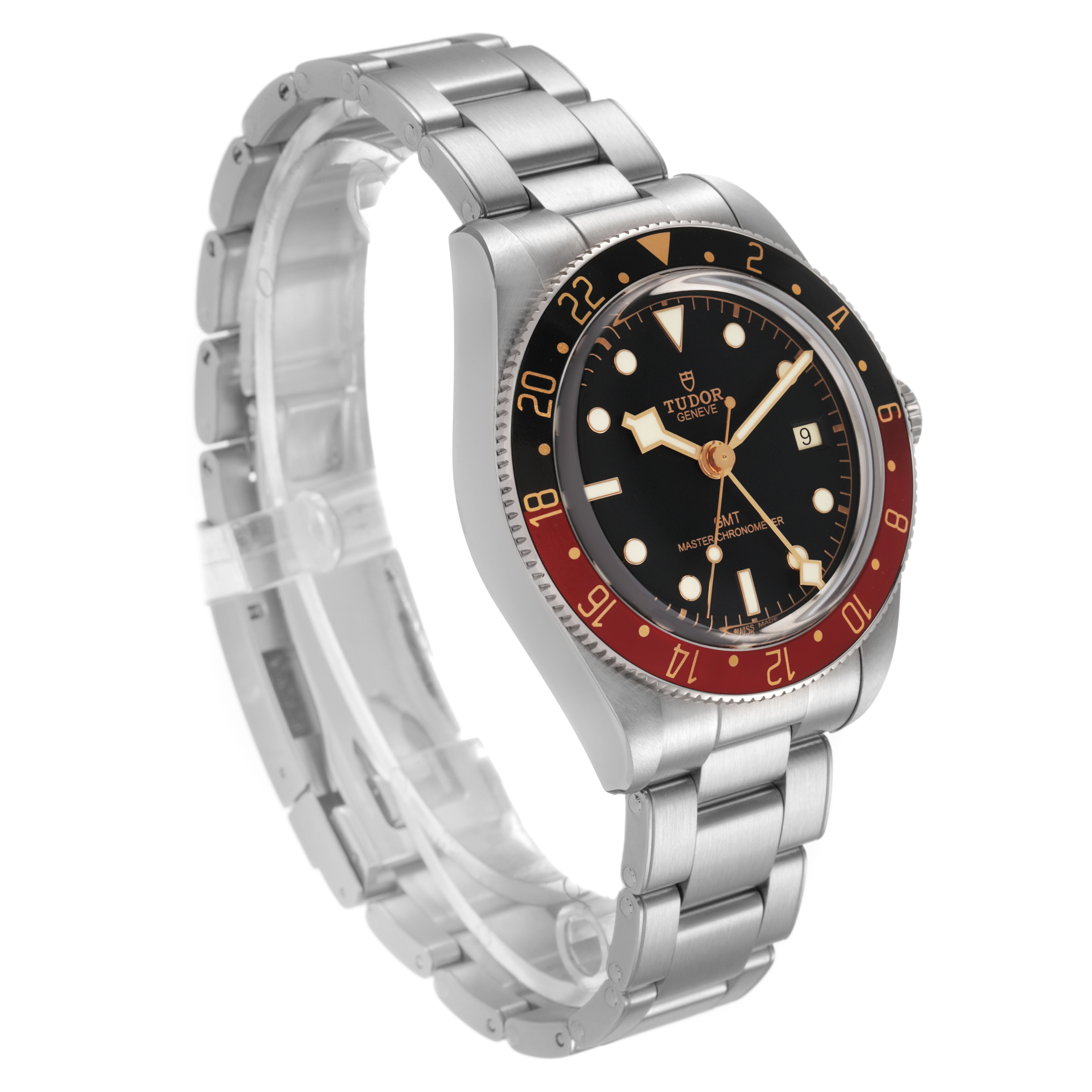 The image shows the Tudor Heritage Black Bay 7939G Men's Stainless Steel Black Dial watch from a three-quarter angle, highlighting the dial, bezel, and bracelet.