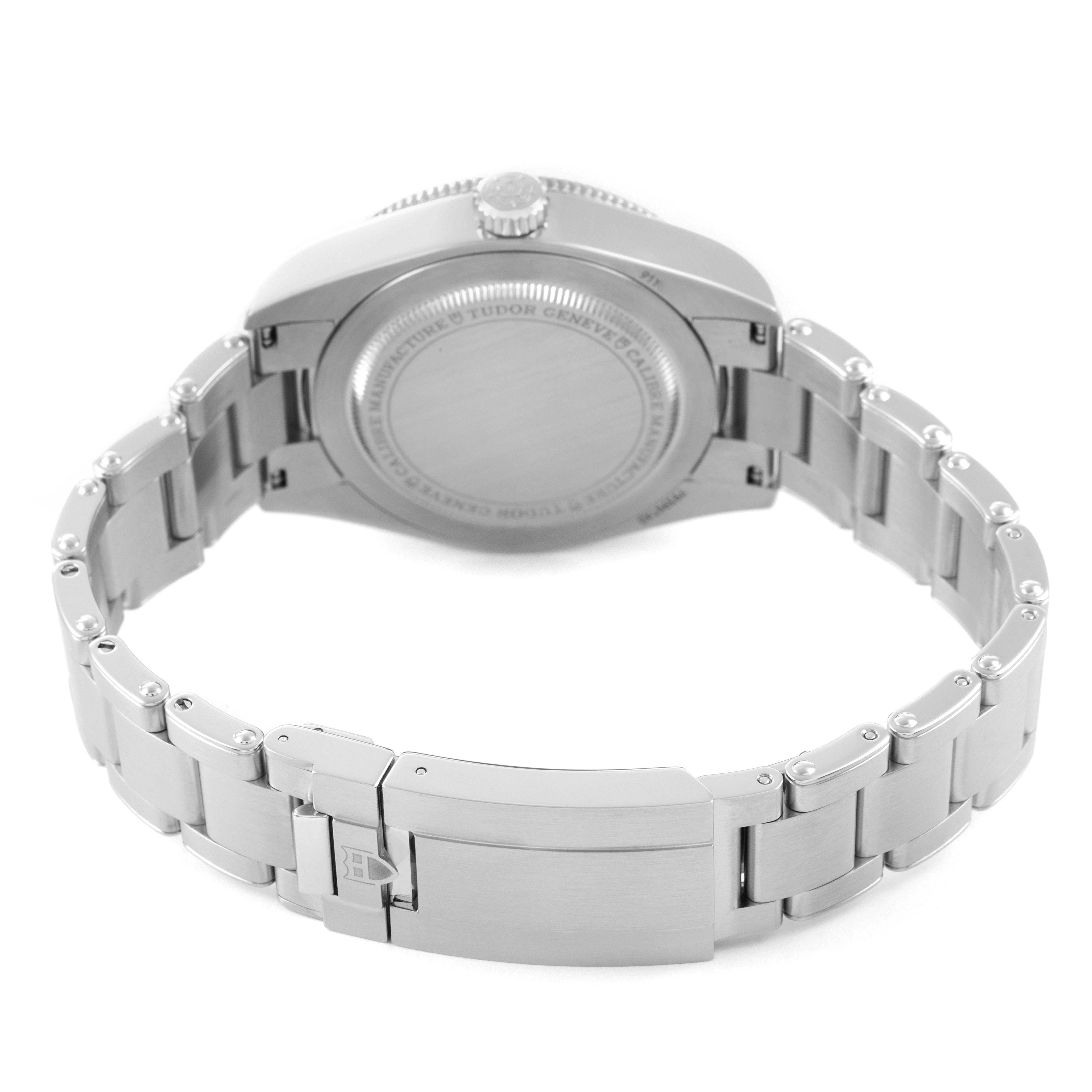 The image shows the back and clasp of a Tudor Heritage Black Bay 7939G Men's Stainless Steel Black Dial watch from a slightly elevated angle.