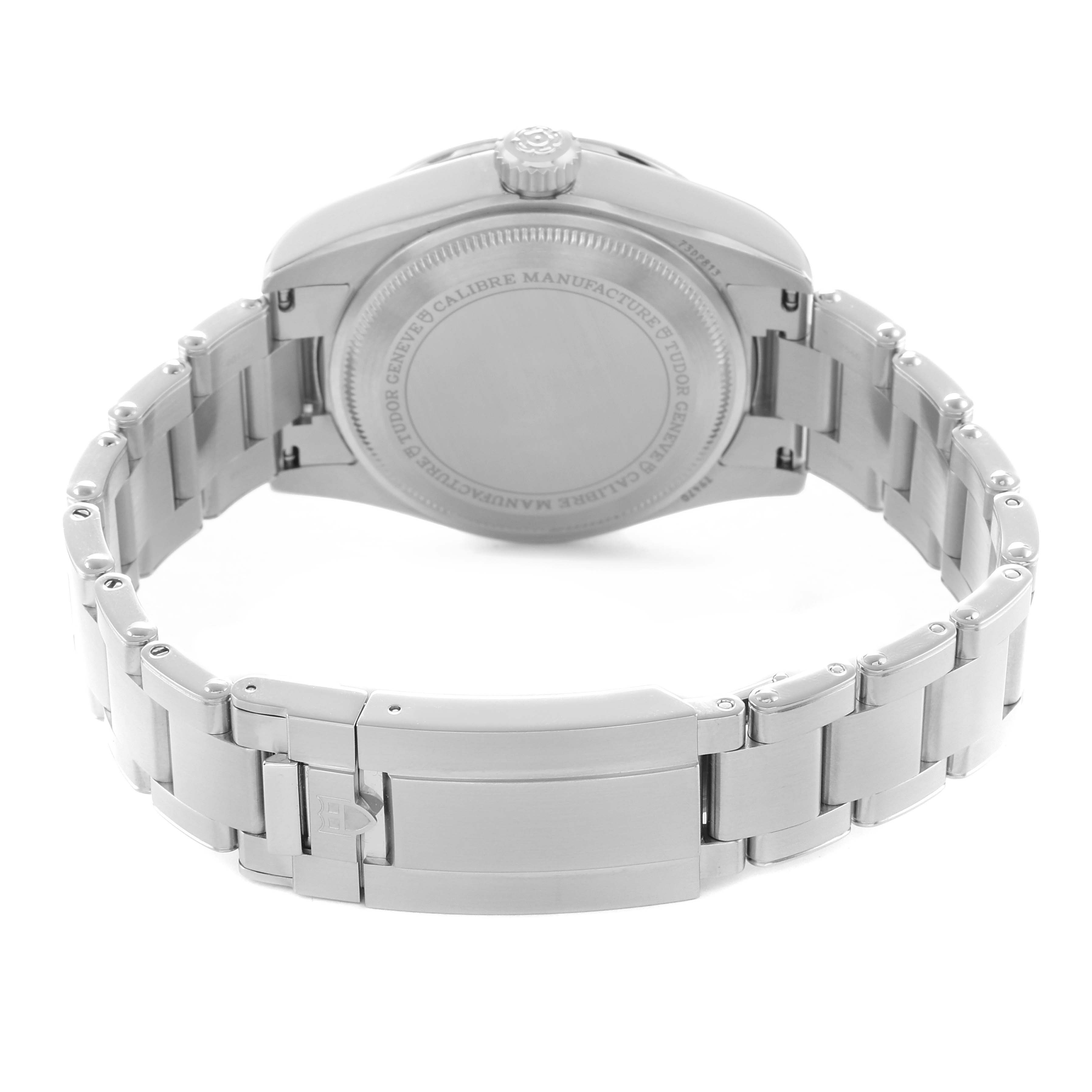 The image shows the back and clasp of the Tudor Heritage Black Bay 79470 Men
s Stainless Steel Black Dial watch with a focus on the bracelet and case back.