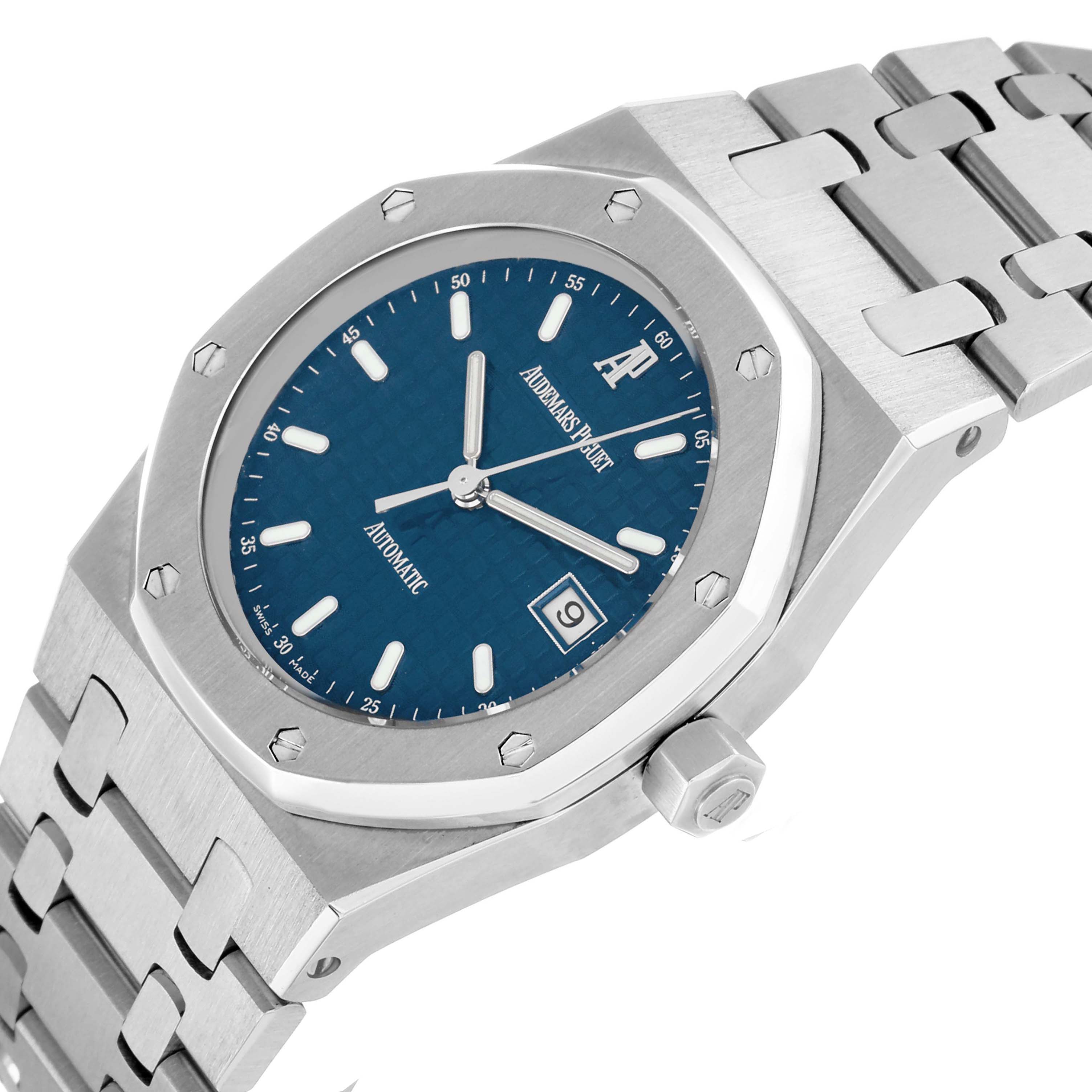 The Audemars Piguet Royal Oak 15000ST.OO.0789ST.05 Men
s Stainless Steel Blue Dial watch is shown at an angle highlighting the dial, bezel, and bracelet.