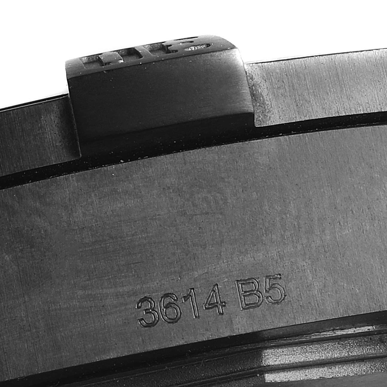 This is a close-up image of a part of the Breitling Chronomat V17310 Men's Titanium Black Dial V17310 Men's Titanium Black Dial watch, showing a section of the bezel with the model number "3614 B5" engraved.