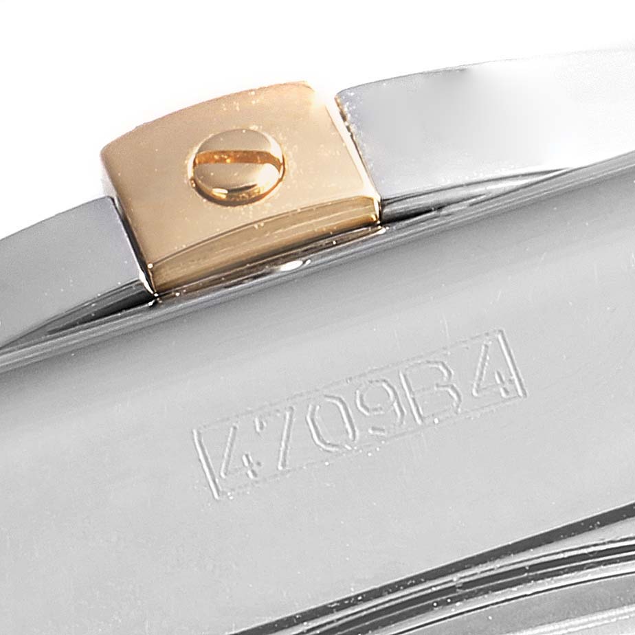 This close-up image shows part of the metal watch bracelet and clasp with engravings of a Breitling Chronomat IB0110 Men's Stainless Steel Black Dial IB0110 Men's Stainless Steel Black Dial model.