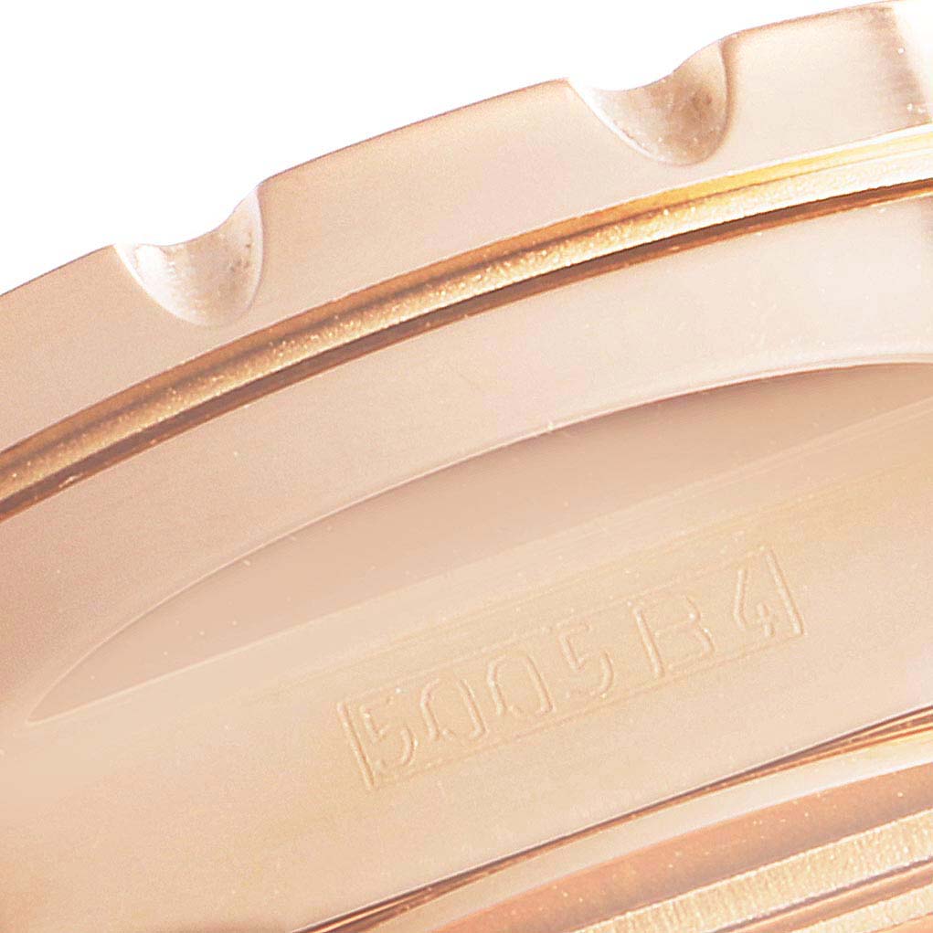 Close-up of the bezel and part of the casing of a Breitling Chronomatic H22360 Men's Rose Gold Black Dial H22360 Men's Rose Gold Black Dial watch.