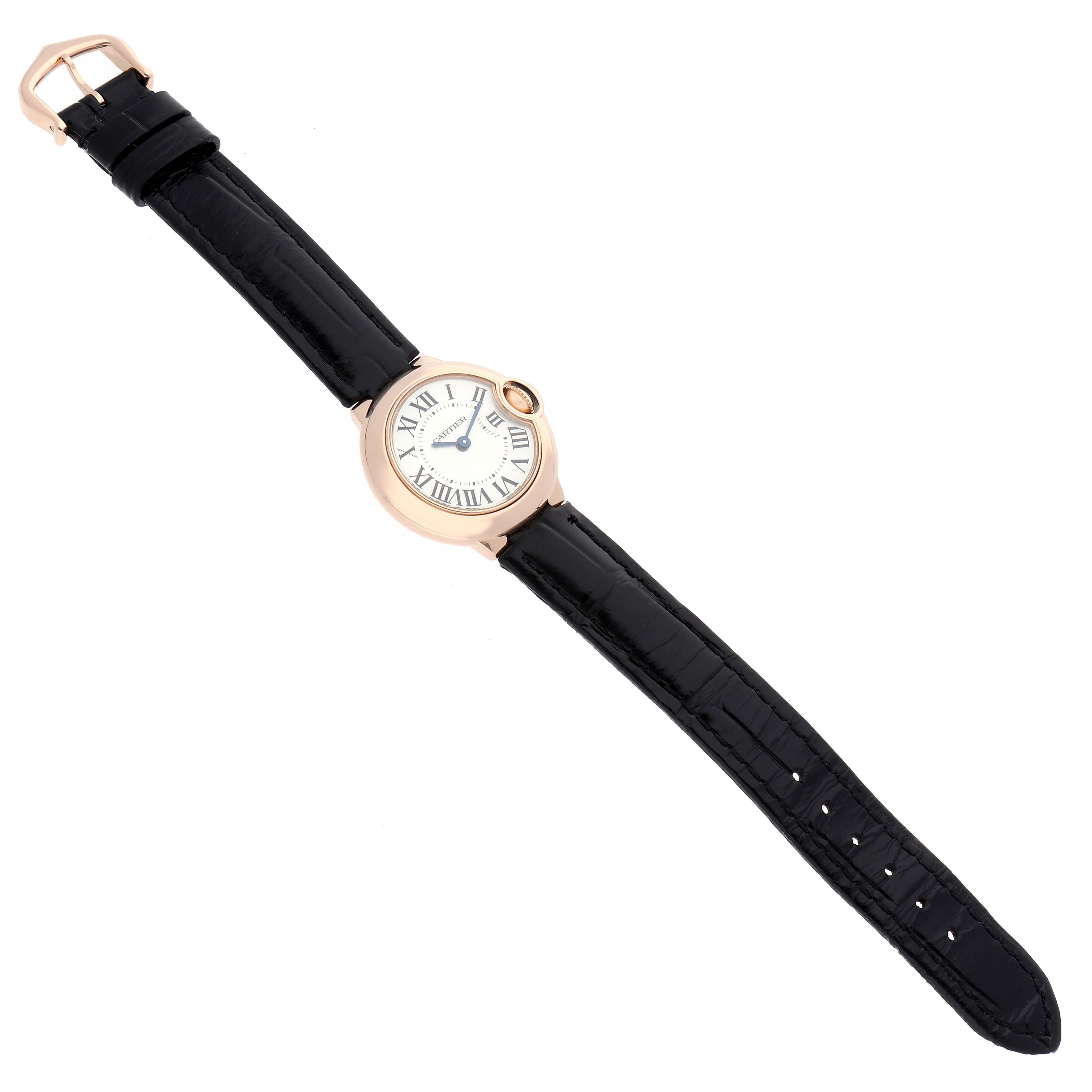 The image shows a top view of a Cartier Ballon Bleu W6900256 Women's Rose Gold Silver Dial watch with a black strap and a rose gold case.