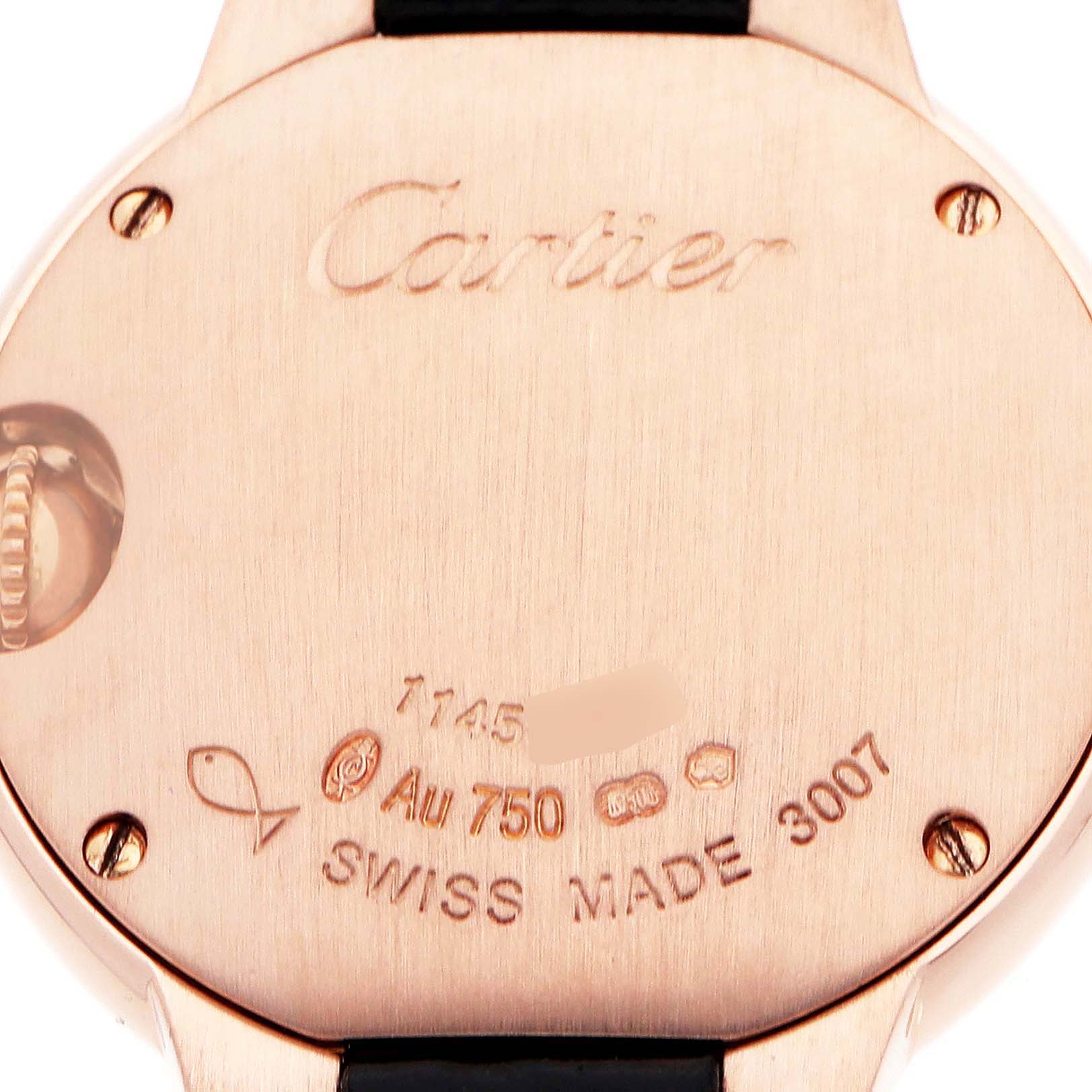 The image shows the back of a Cartier Ballon Bleu W6900256 Women's Rose Gold Silver Dial watch, featuring engravings and part of the strap and crown.
