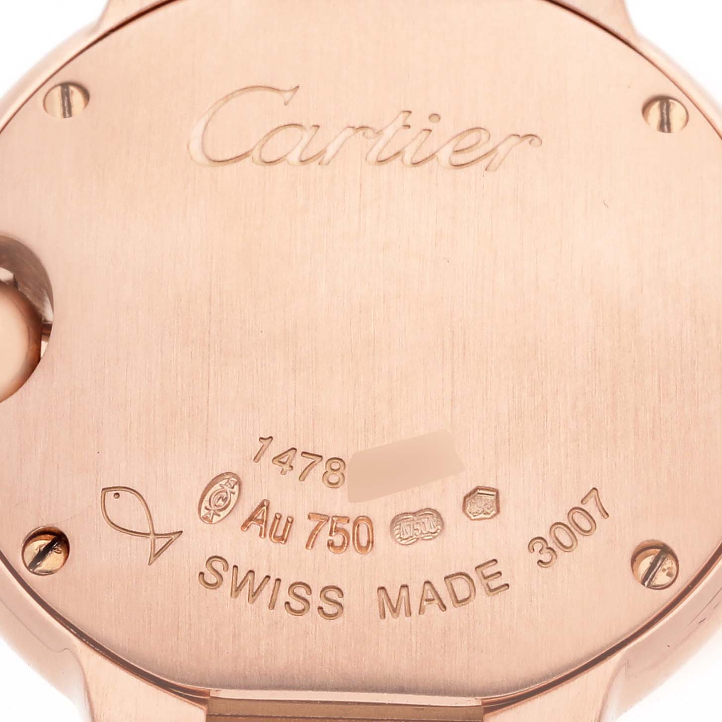 The image shows the back case of a Cartier Ballon Bleu W6900256 Women's Rose Gold Silver Dial watch, featuring engravings and hallmarks.