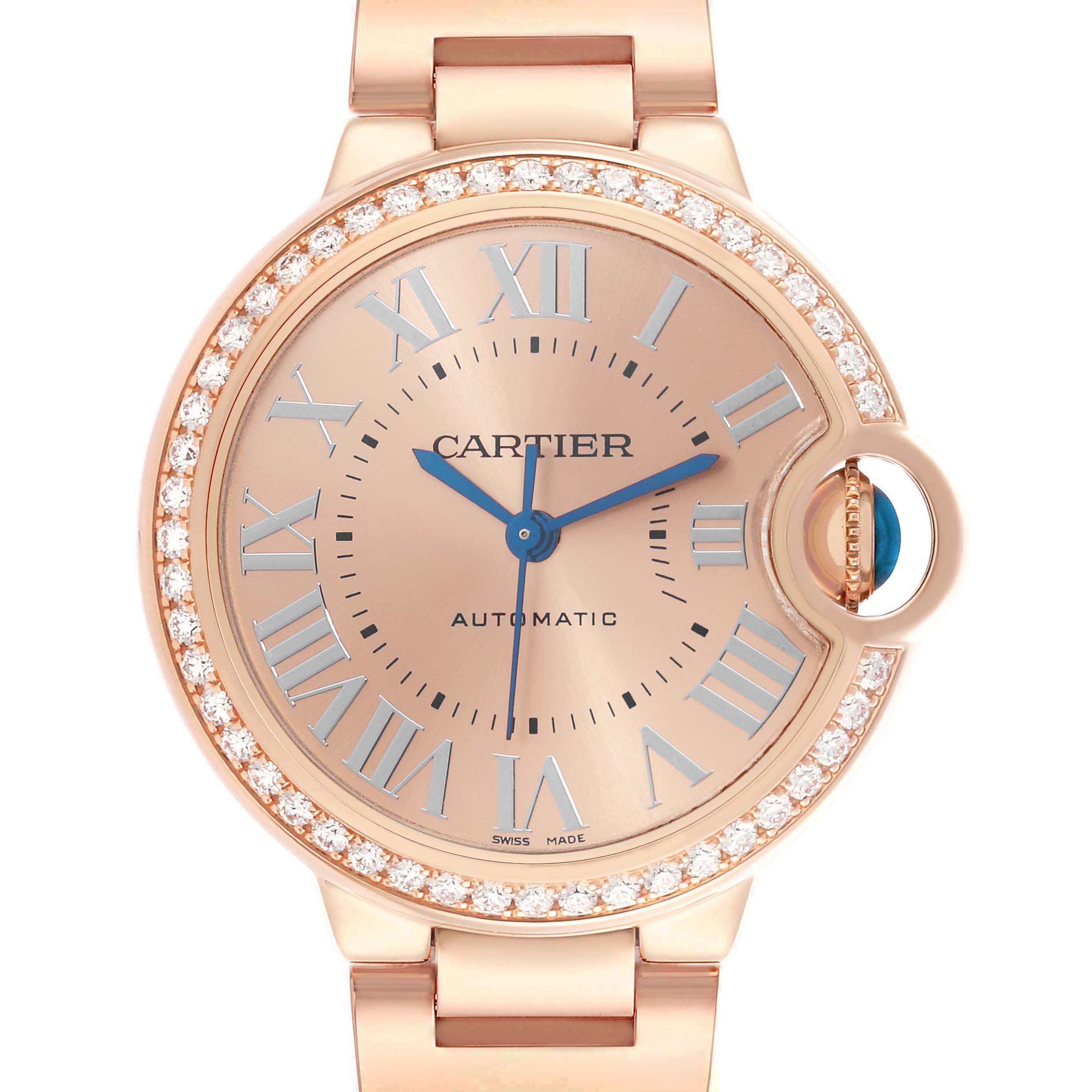 The Cartier Ballon Bleu WJBB0077 Women's Rose Gold Pink Dial watch is shown from a front angle, featuring a diamond bezel, blue hands, and Roman numeral markers.