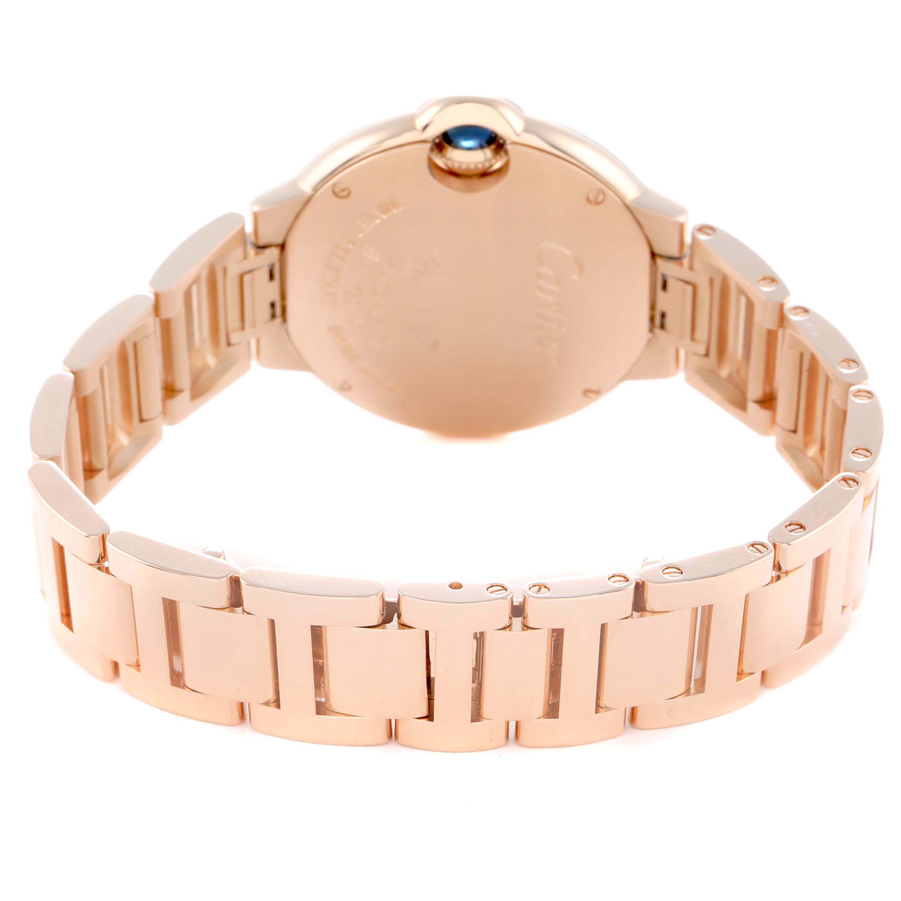 The image shows the back and bracelet of a Cartier Ballon Bleu WJBB0077 Women's Rose Gold Pink Dial watch, highlighting the case back and metal links.