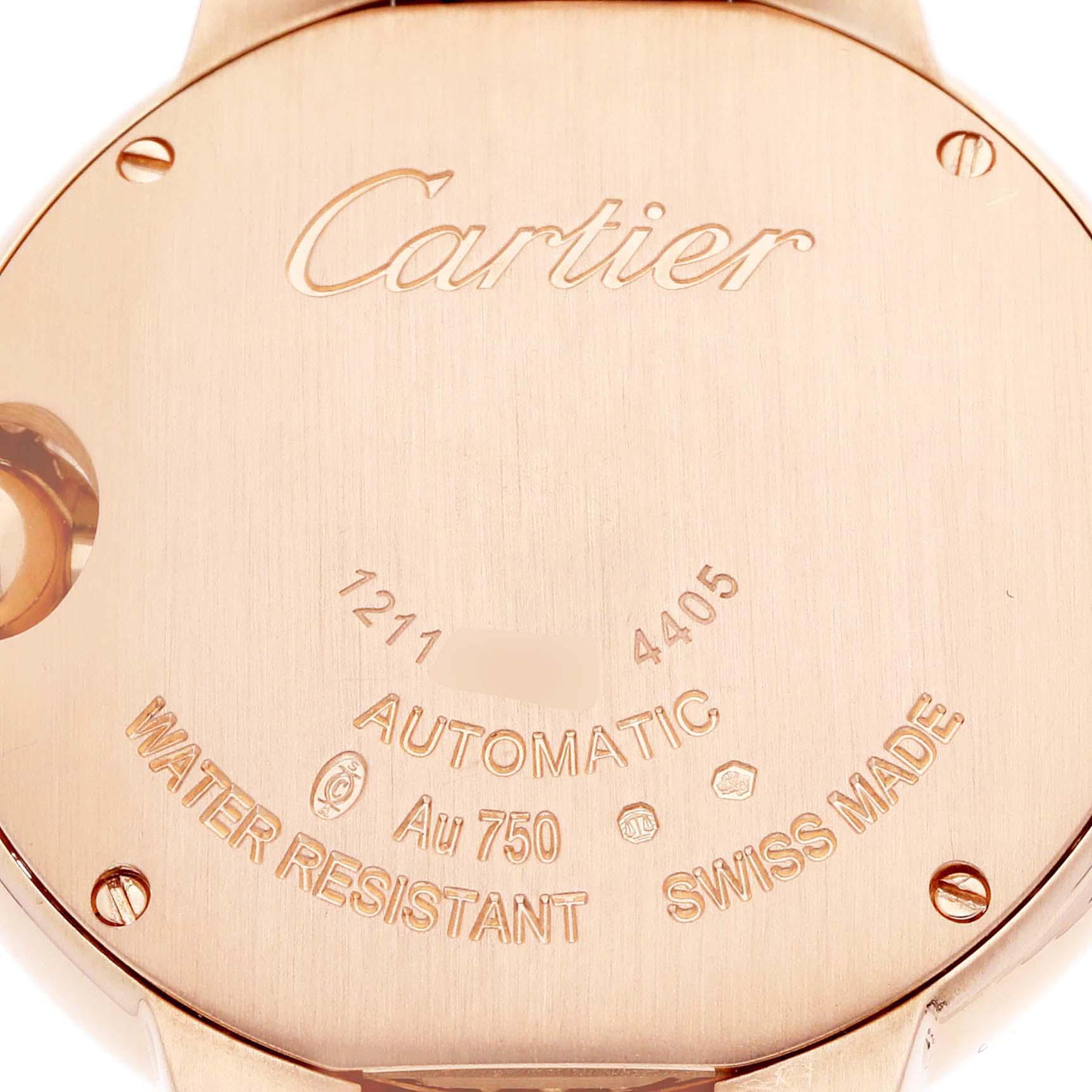 The image shows the back case of a Ballon Bleu by Cartier, featuring engravings and screws.